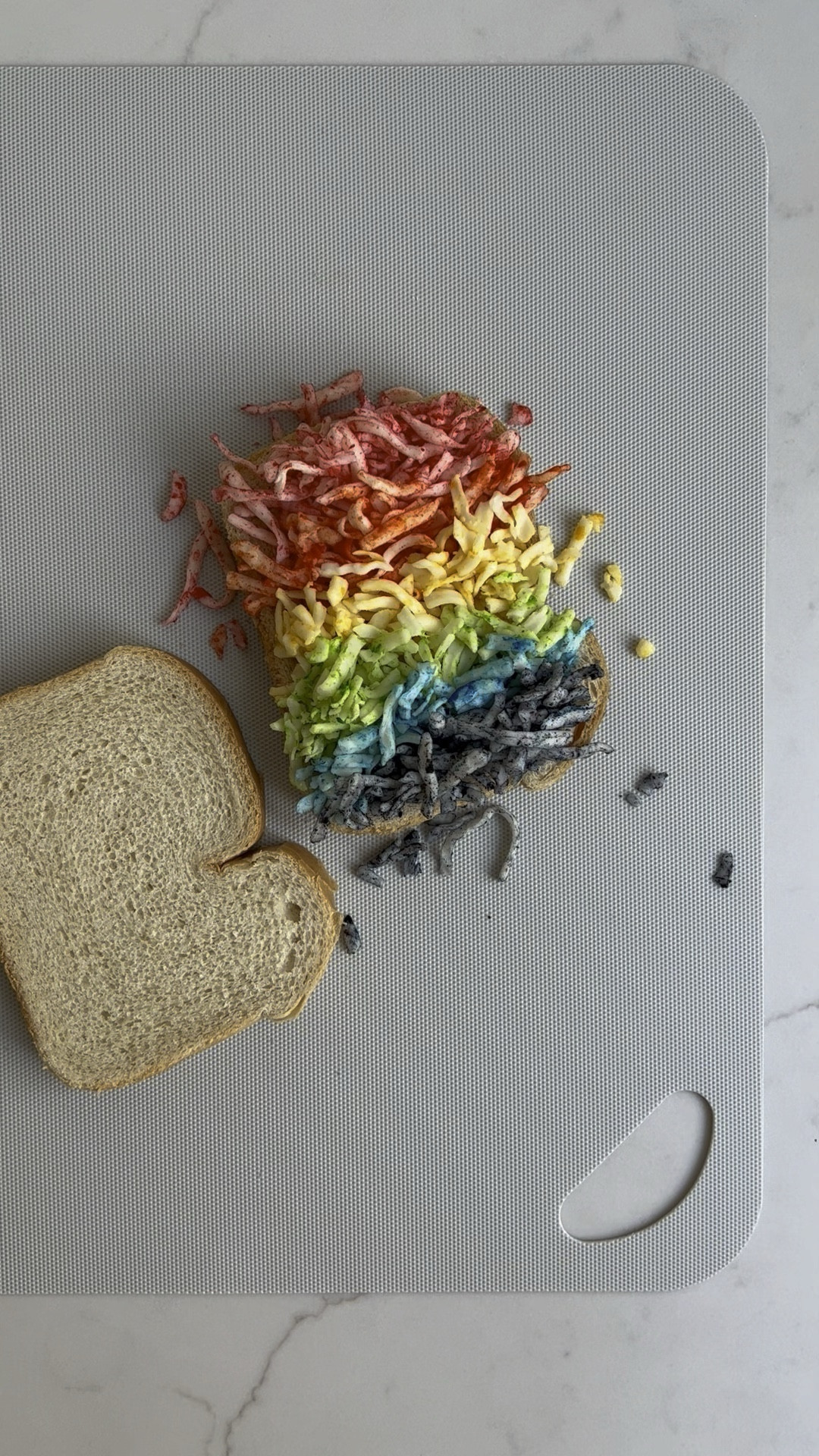 Rainbow Grilled Cheese
❤️🧡💛💚🩵💜
Is it a low-maintenance dinner for a Monday? Maybe not, but it’s surprisingly easy and a fun way to make a usual more interesting. (My kids wouldn’t touch grilled cheese until I put this spin on it!) It’s also perf for St. Patrick’s Day. 
❤️🧡💛💚🩵💜
Put one drop of food coloring in a small bowl (one for each color), add a small handful of shredded mozz, and stir. Swipe outer sides of sandwich with mayo (trust me, it’s way better than butter!), add cheese to non-mayo side of one slice in rainbow order and pop other slice on top with mayo side up, brown each side over medium heat until golden, crispy, and melted inside. 
❤️🧡💛💚🩵💜

#LTKkids #LTKVideo #LTKfamily