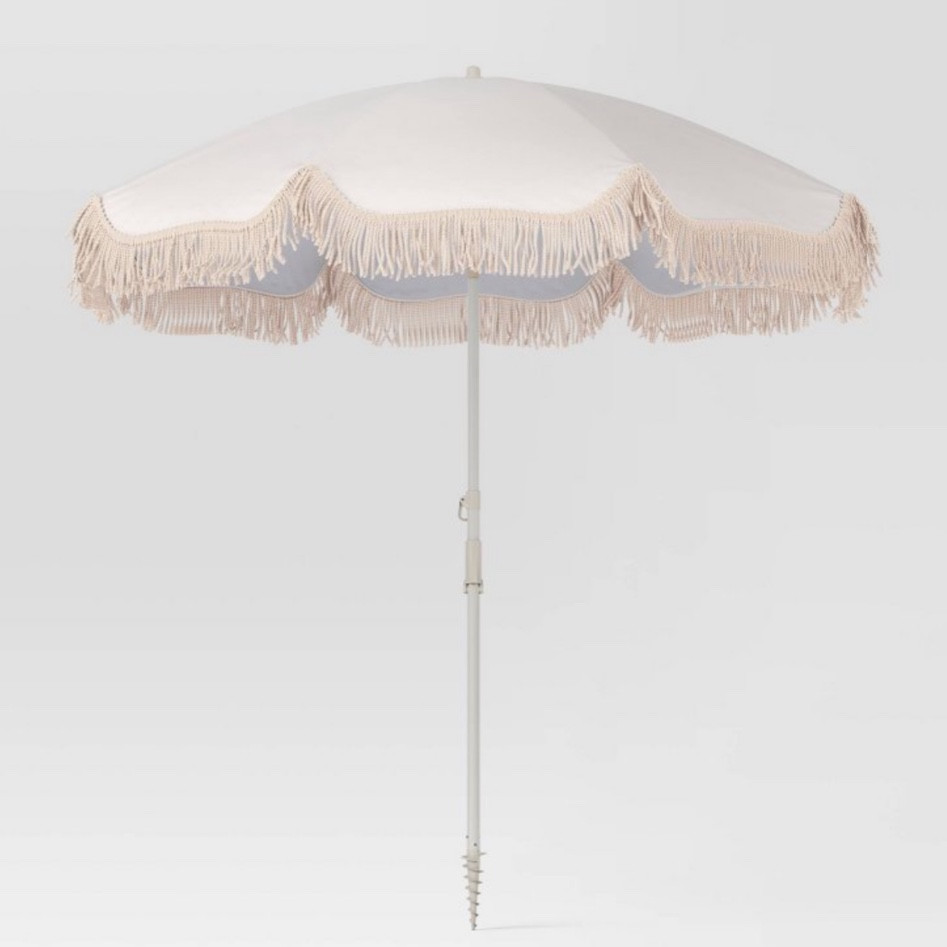 Fringe ivory umbrella for patio table 

#LTKFind #LTKSeasonal #LTKhome