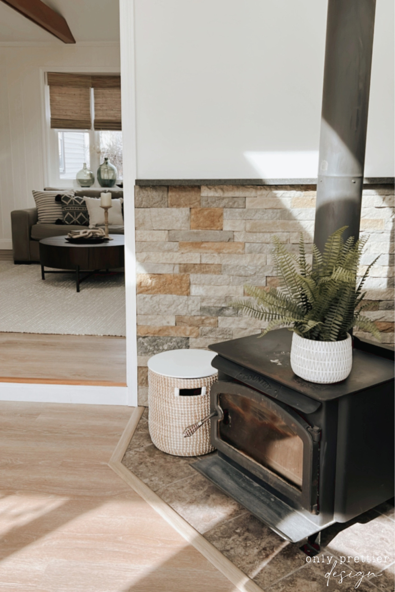 This fireplace area outside of the living room is a beautiful focal point in this space. 🌿

#LTKhome