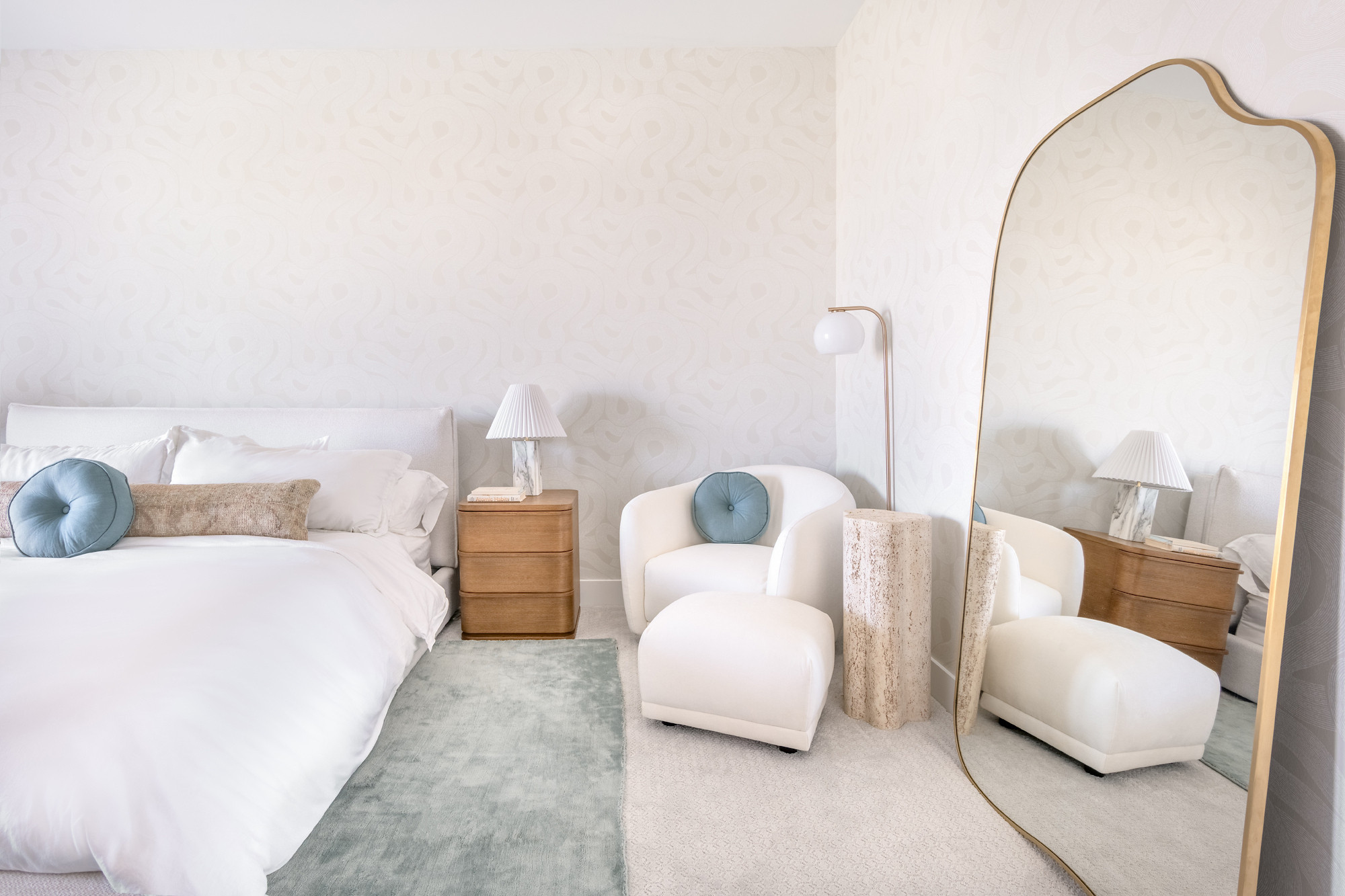 Step into serene sophistication with this dreamy primary bedroom retreat. The space is anchored by elegant faux wooden ceiling beams that add warmth and architectural interest, drawing the eye upward and creating a cozy, yet airy ambiance. A soft, velvety area rug underfoot adds plush texture and sets the stage for the bed, which is layered in crisp white linens and calming neutral tones. 

 #LTKHome