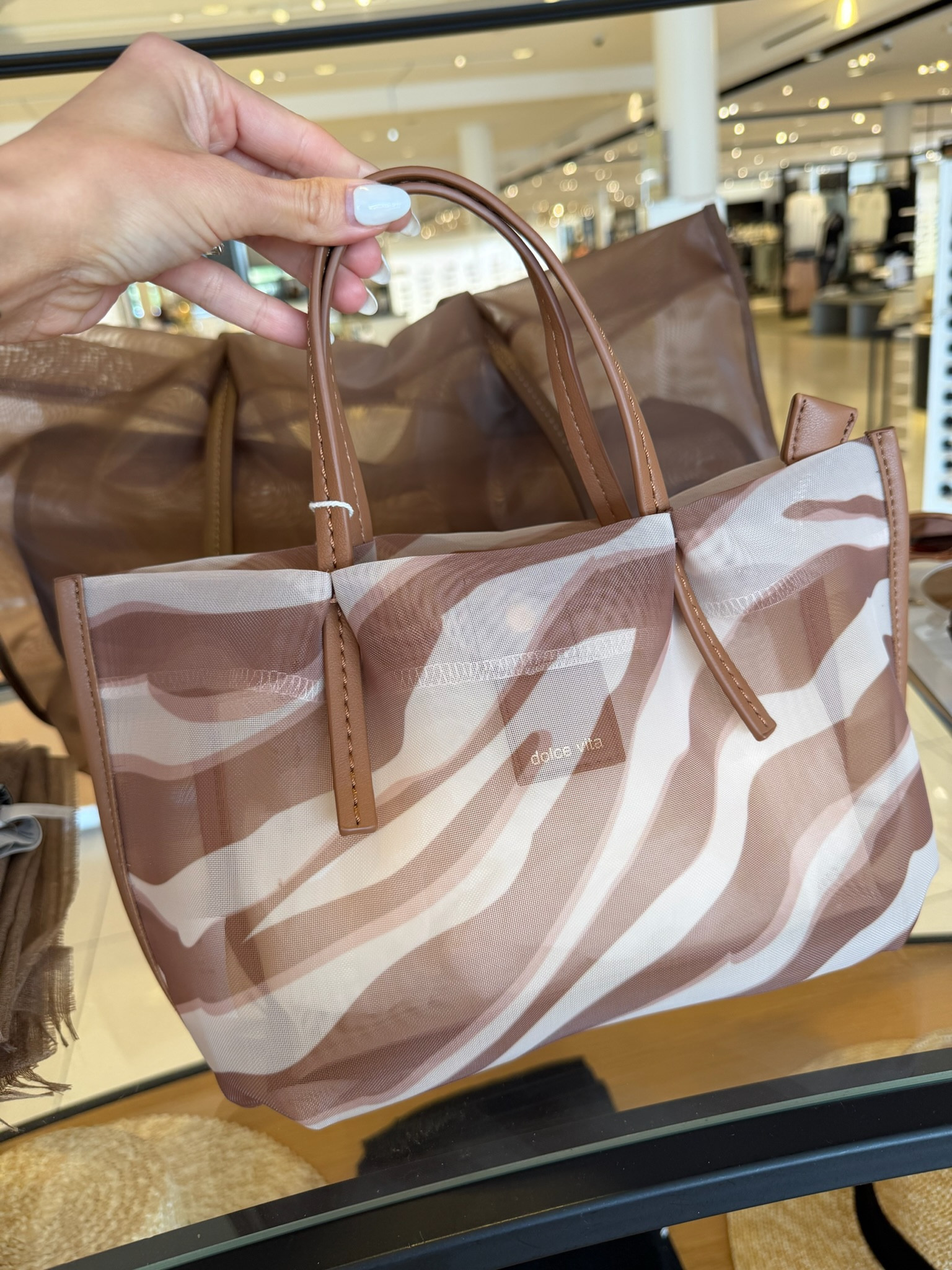 this tote is so chic.  the perfect mix of neutral and statement, lightweight but still holds everything you need

summer bag, everyday tote, beach bag, neutral style, annabrstyle 

#LTKTravel #LTKootd #LTKSeasonal