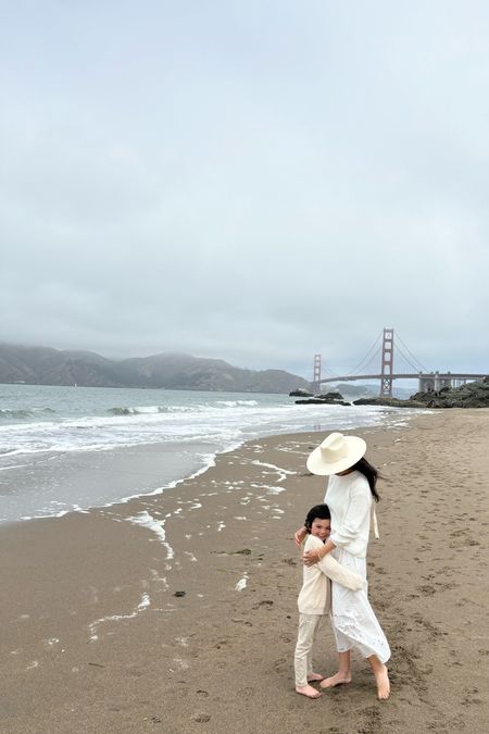 White & beige outfits for a breezy beach walk in San Francisco.
1. White eyelet skirt. Not at all see through and it’s so comfortable too. I’m wearing a small. 
2. White cotton fisherman sweater in a small. The quality of this is incredible and the price is unreal!
3. Ivory hat with ties. I usually wear medium hats in this line, but I sized down to a small. 
4. My little boys beige waffle-knit sweater is on sale. His jeans are Zara kids  

Beach family photos 
Janessa Leone Palmer hat
Best fisherman sweater 
Summer white outfit 

#LTKSaleAlert #LTKFamily #LTKTravel