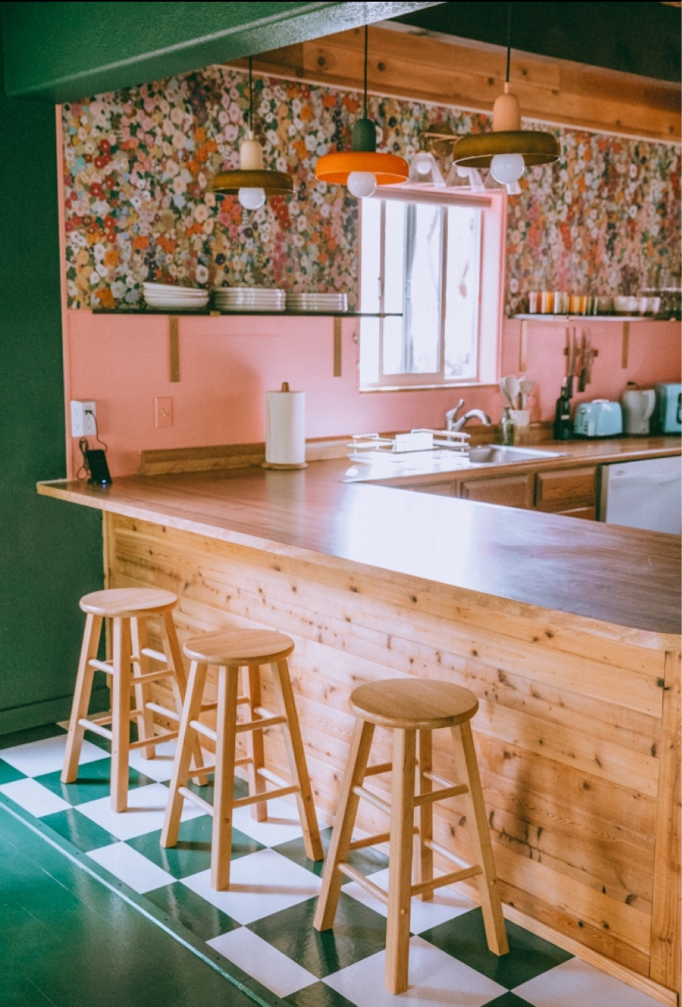 colorful home decor in my cabin airbnb in California! This colorful interior has been featured in Dwell and Apartment Therapy. it has nordic and eclectic design style and is full of dopamine decor! #decor #homedecor #interiordesign #whimsyhomes #colorful #rug #couch #dopaminedecor #nordic
