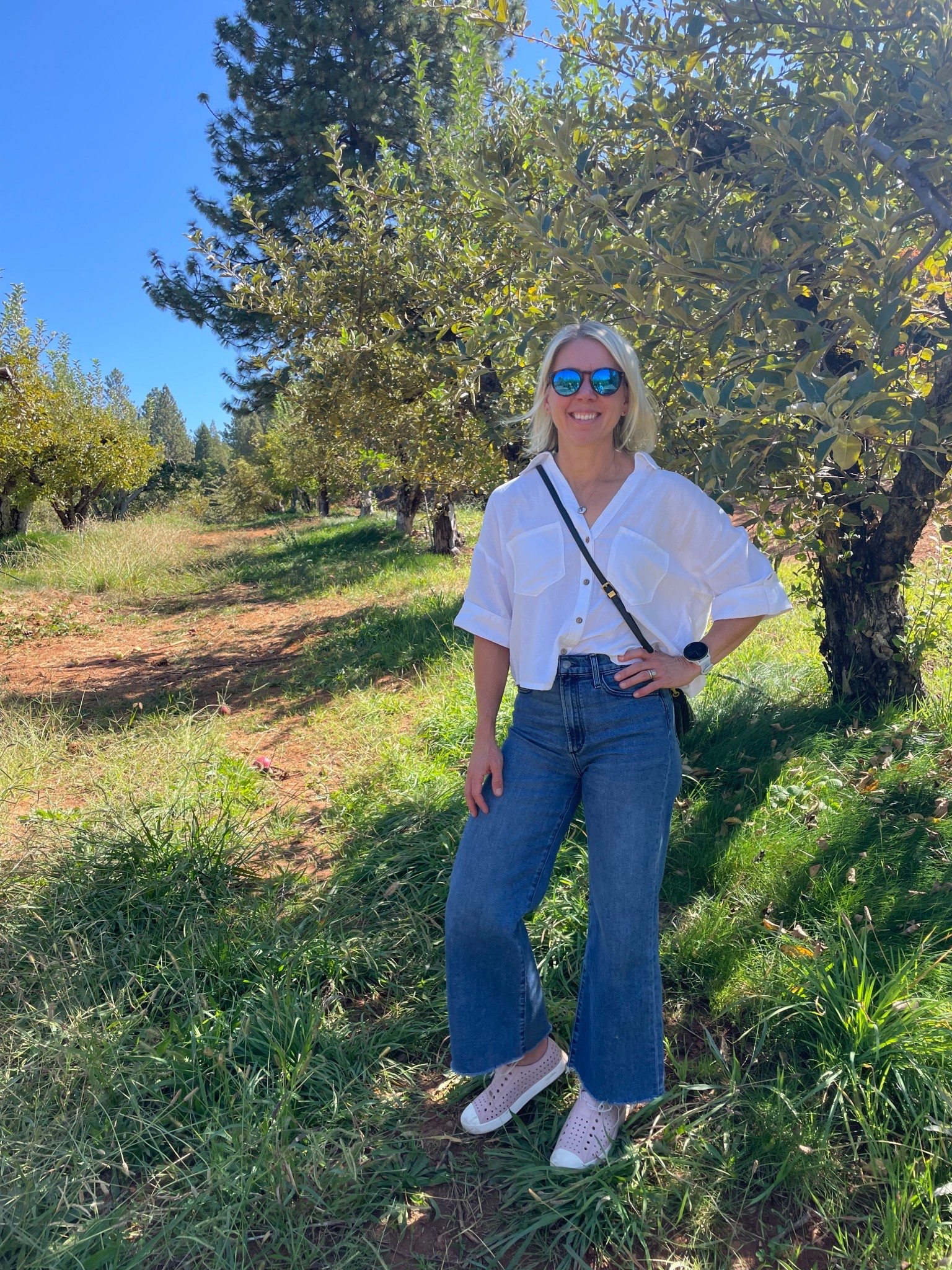 Apple picking outfit of the day: The Jeffersons from Native Shoes for all-day comfort, wide-leg Joe’s Jeans, a linen crop button-down from Zara, a small purse, and fun sunglasses. Casual, comfortable, and perfect for fall days at the orchard. Linked everything here.

#NativeShoes #LTKstyle #falloutfit #applepicking #momstyle