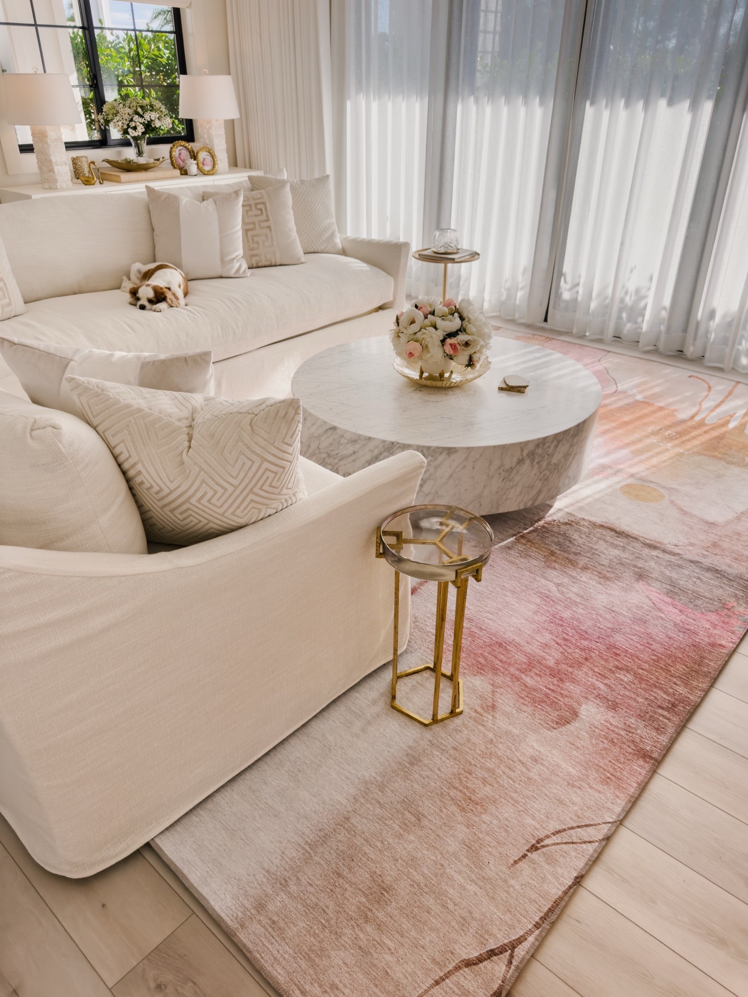 Adding a little color with this beautiful abstract rug in our living room. We love it! It just dropped in price again also so the 9 x 12’ size is under $390. 👏🏼

I have the Mauve color.

Our large faux tree is the 8 foot tall size. 
My sectional is in the fabric color - canvas.
Our 48” marble coffee table and 96” Byron reeded cabinet are from Restoration Hardware. ￼

#LTKHome #LTKSaleAlert