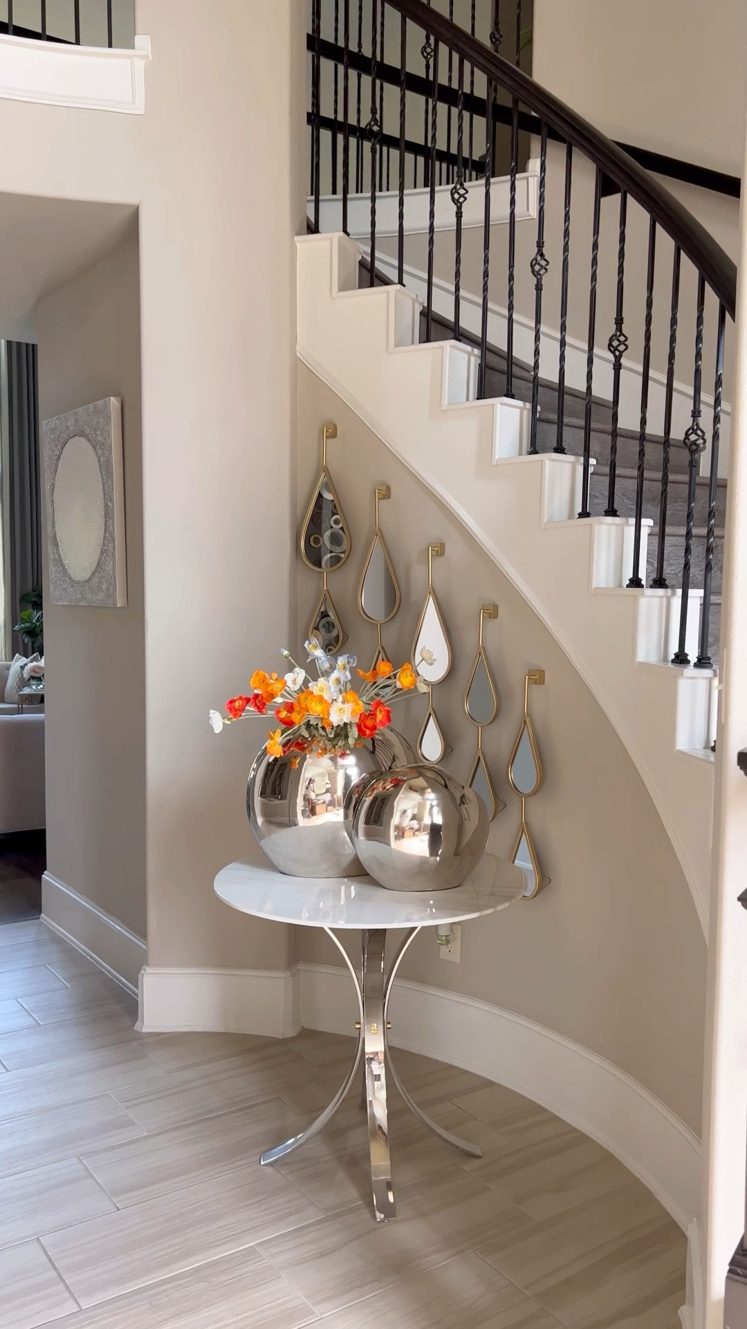 Shop entryway decor. You can get these florals in different colors. Also, you can style these gorgeous vases with or without flowers. The popular teardrop mirrors are also available in silver #homedecor #falldecor #foyerdecor #roundtable #diningtable 

#LTKHoliday #LTKGiftGuide #LTKhome