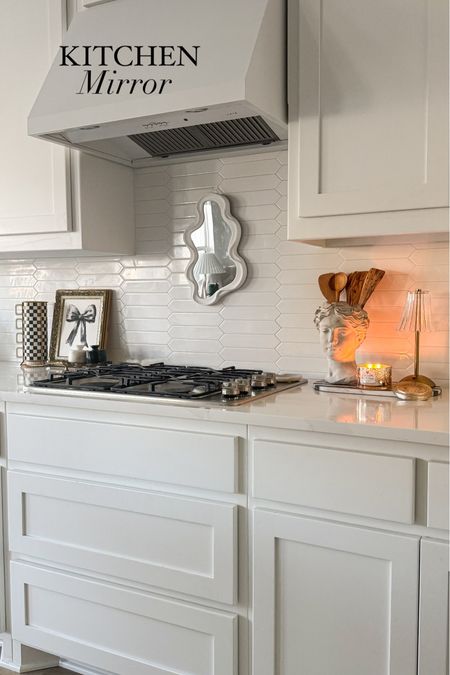 Have you tried a mirror above your stove?? We love this wavy, asymmetrical mirror here!

#LTKfindsunder50 #LTKstyletip #LTKhome