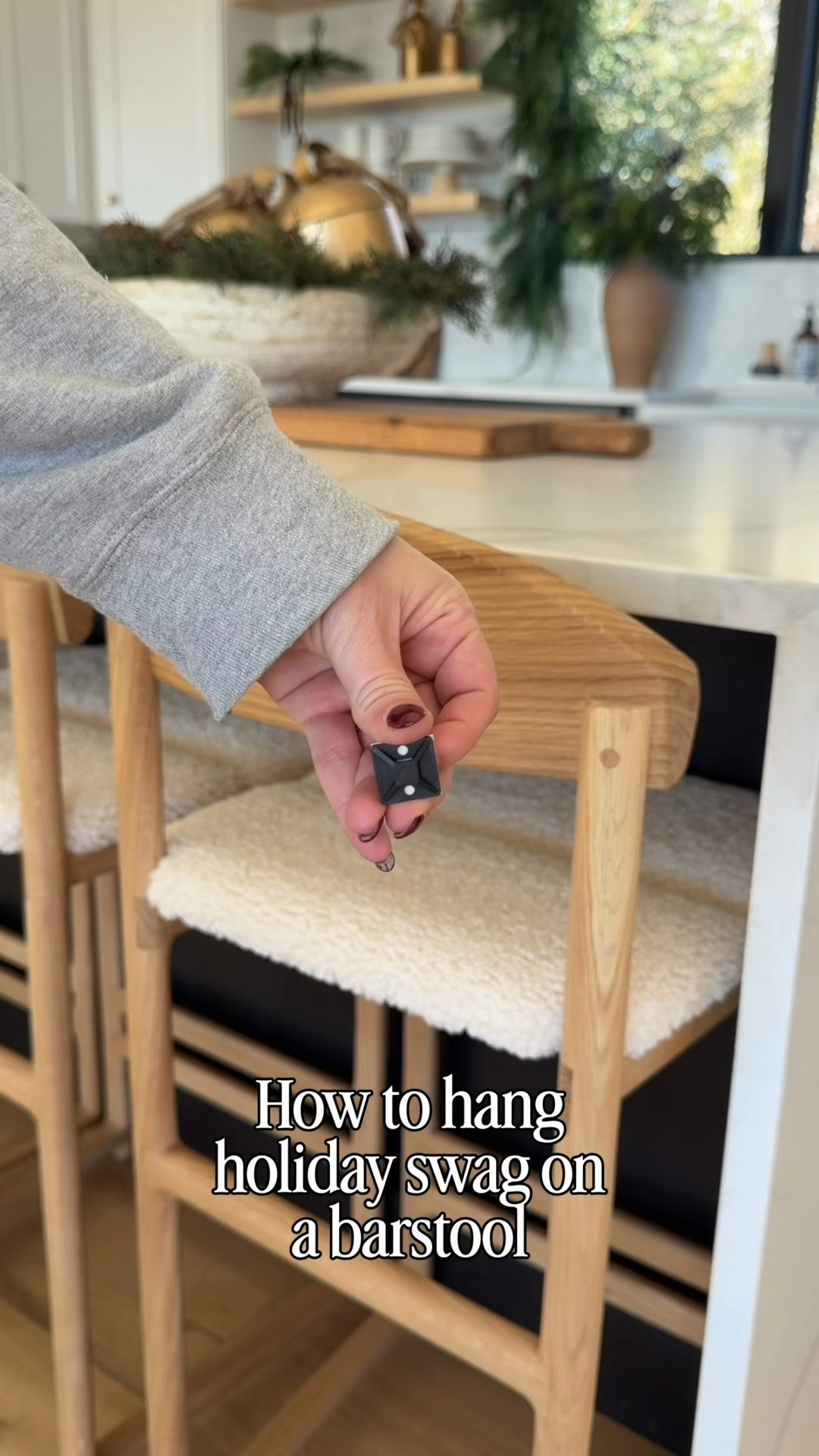 Holiday kitchen details that make the whole space feel festive — and it’s so easy to recreate. I hung fresh holiday swags on our by Crea Ted barstools using 3M Command hooks + zip ties for a clean, damage-free way to secure garland without hardware or drilling. Highly recommend if you love decorating chairs, barstools, or railings without commitment.

The mix of ivory boucle seats, warm oak wood, matte black accents, and simple greenery feels modern, minimal, and still cozy for Christmas. Paired with layered garland over the windows, warm wood accessories, open shelving and soft twinkling lights — it’s festive without overwhelming the kitchen.

Sometimes the smallest details make the biggest holiday impact.

#LTKSaleAlert #LTKHome #LTKHoliday