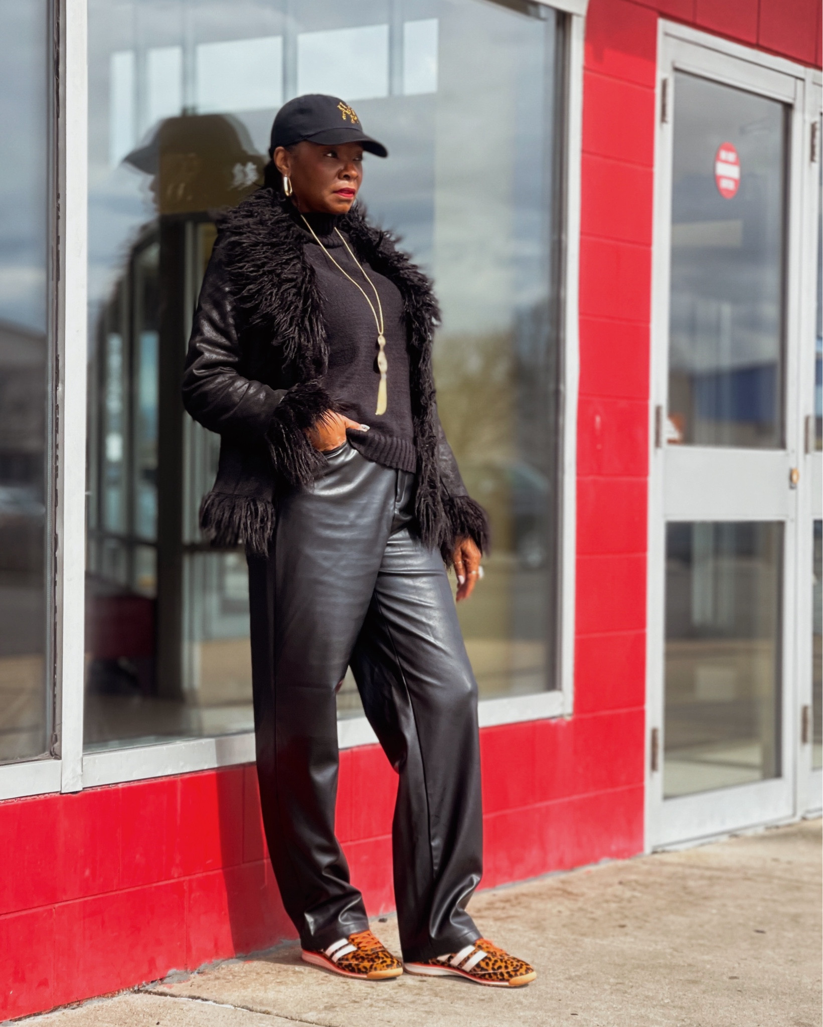 Faux leather Pants; leopard print yankee hat; adidas sneakers 