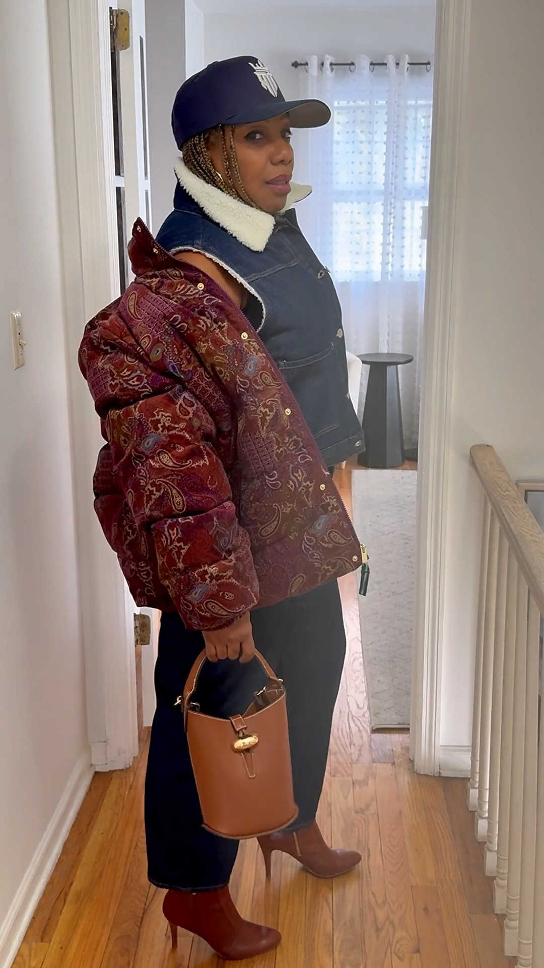 Easy layers, strong mix.
A patterned puffer adds interest over a denim vest and dark denim, finished with ankle boots and a small structured bag. Casual pieces styled with intention—comfortable, layered, and pulled together for everyday wear.

#LTKOver40 #LTKootd #LTKMidsize