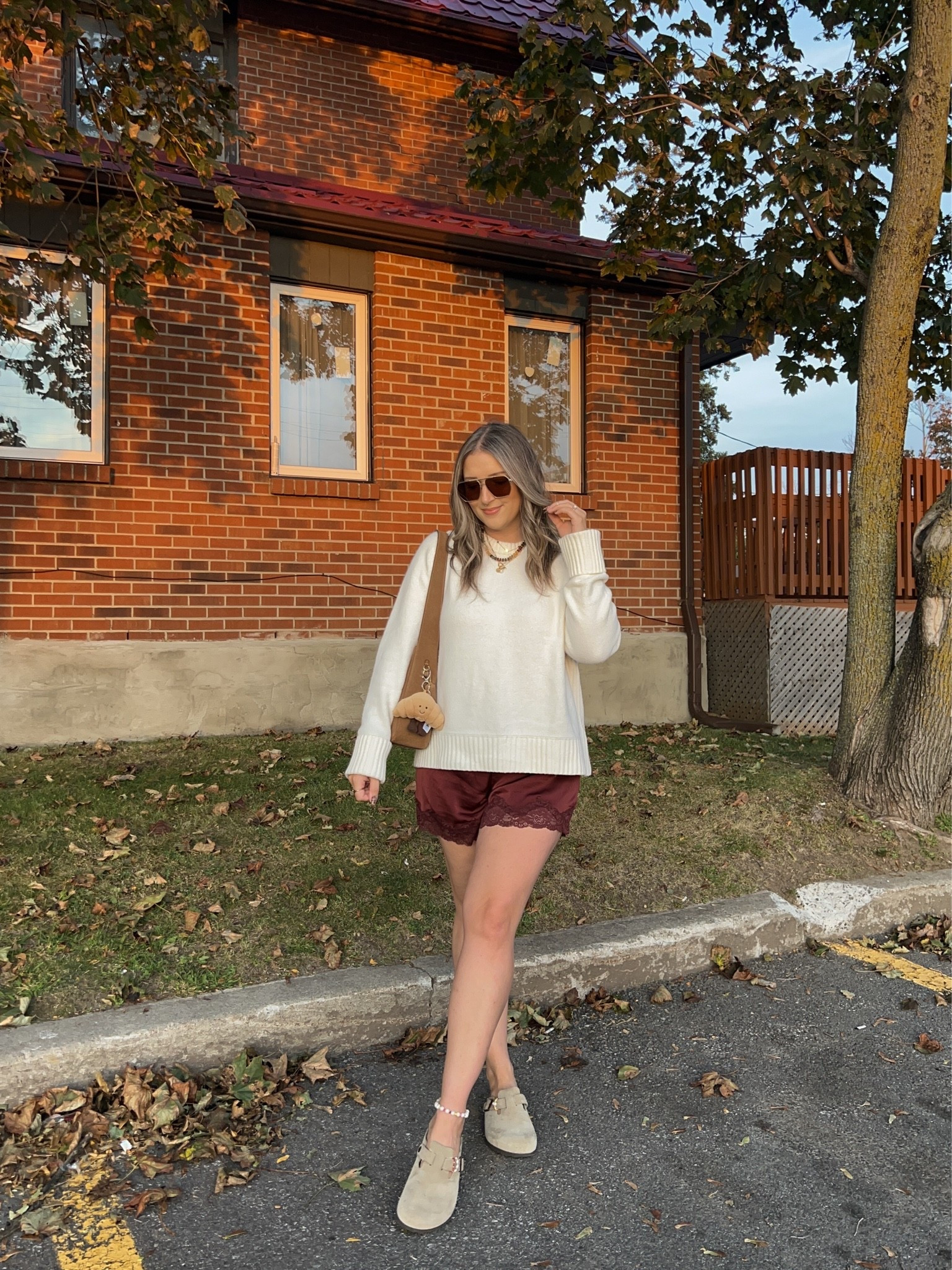 Comfy fall outfit! Sized up to XL in the sweater for an oversized fit. Wearing M in the satin lace shorts. I’m a 9.5-10 shoe and wear a 40 in the Birkenstock clogs

#LTKfall #LTKsale #LTKstyletip