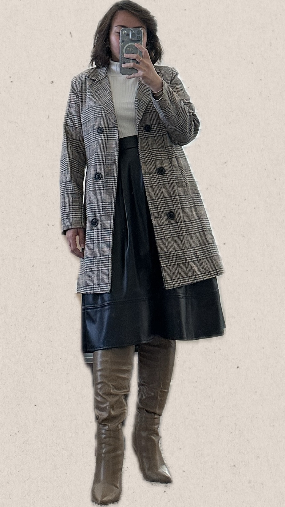 Here's a stylish ensemble: Start with the classic white turtleneck as the foundation, providing a clean and timeless look. Layer on the statement piece, the Plaid Lapel Double Breasted Overcoat, adding sophistication and a pop of pattern. Pair it with the edgy black faux leather below the knee skirt for a bold contrast. Finish the outfit with pointed toe knee-high boots, elongating the legs and adding a touch of elegance with each step. This ensemble balances classic elements with contemporary flair, making a chic and confident statement.

#LTKstyletip #LTKmidsize #LTKfindsunder50
