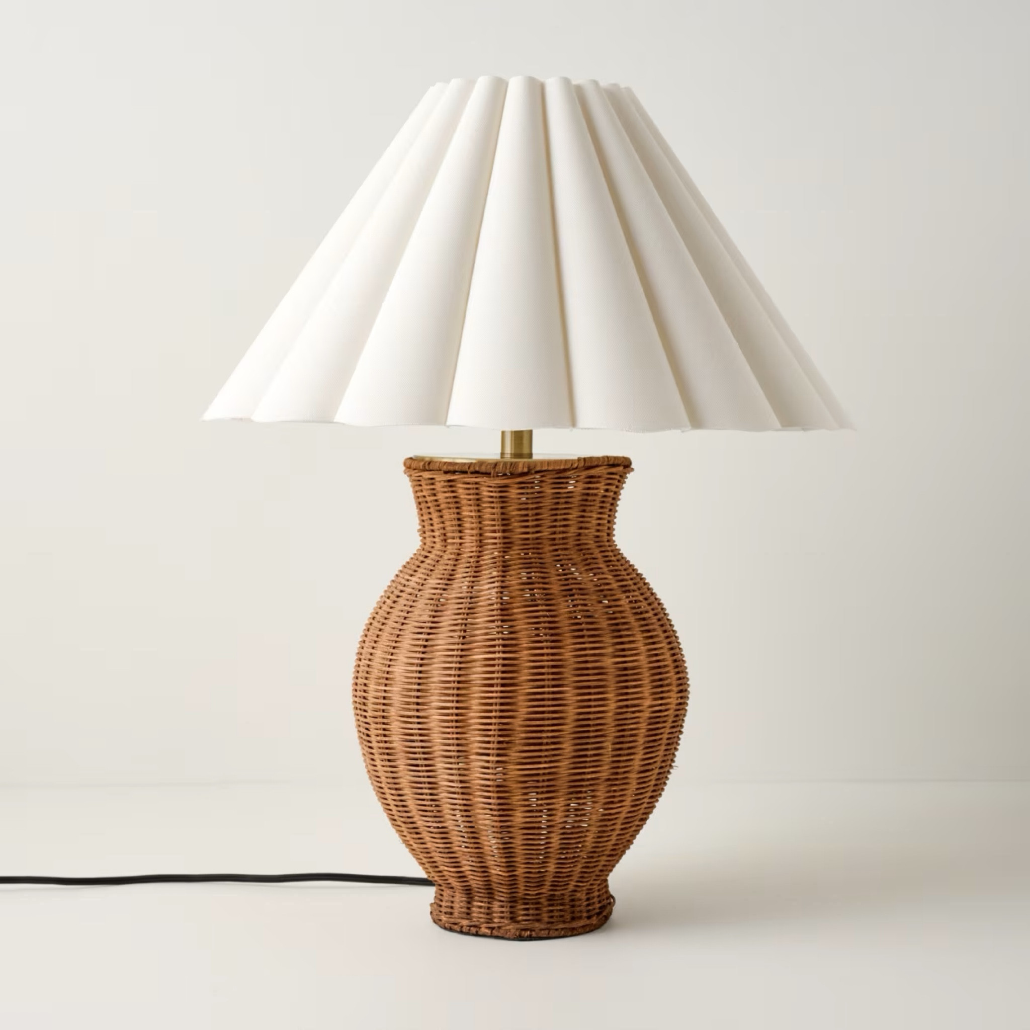 With wide, graceful scallops and a textured, earthy woven rattan base, the Cassie Table Lamp is a striking blend of drama and elegance. This refined piece both accents and brightens a space, effortlessly enhancing any room.

#LTKHome #LTKMostLoved