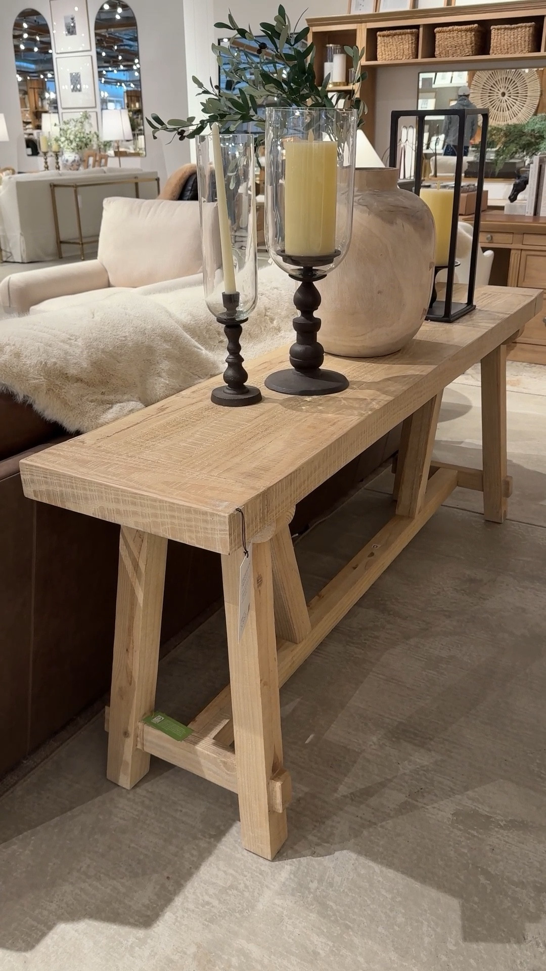 Modern farmhouse style! 😍 The Farmhouse Trestle Console Table from Pottery Barn in the Pale Sand finish is crafted from solid reclaimed pine, giving it that beautiful natural character and rustic charm. 🫶🏻 The classic trestle base adds timeless farmhouse appeal while keeping the look clean and versatile.  Perfect styled in an entryway, hallway, or behind a sofa with your favorite decor pieces. ☺️ Linked this console and similar farmhouse-style tables to shop! ✨ #PotteryBarn #FarmhouseStyle #ConsoleTable 

#LTKHome #LTKSaleAlert