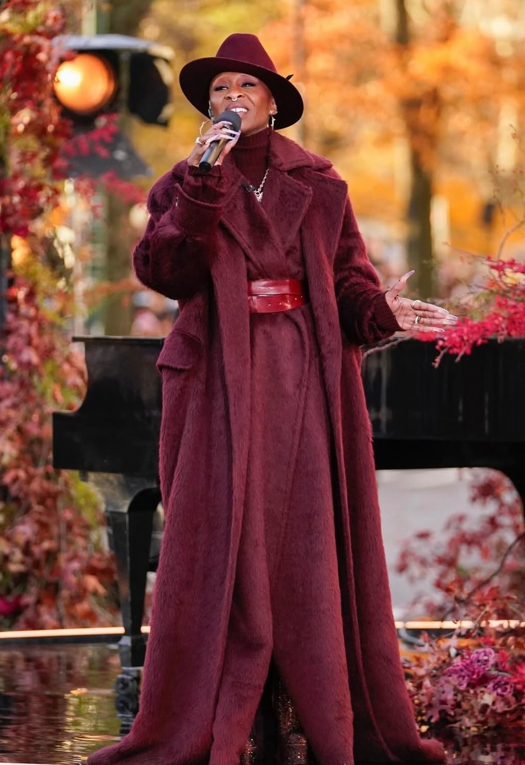 Cynthia Erivo thanksgiving day parade burgundy sleeveless wool and alpaca coat, late night wrap belt cashmere rib turtleneck long wool alpaca coat New York City November 27, 2025