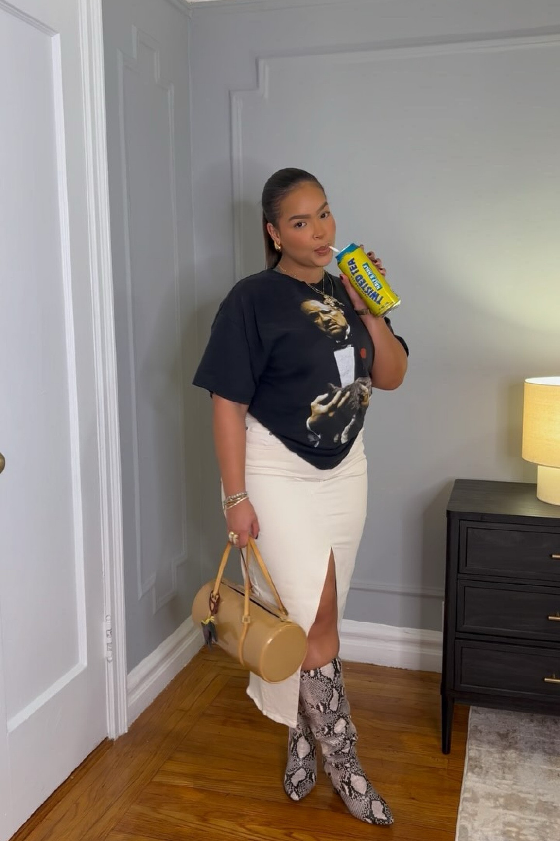 GRWM for a girls night out ⭐️ 
With my partner in crime by my side @twistedtea 
Top: My boyfriend’s closet from @outthebox919 
Skirt: @americaneagle 
Boots: @target 
Bag charm: @amazon 
#grwm #fashion #girlsnight