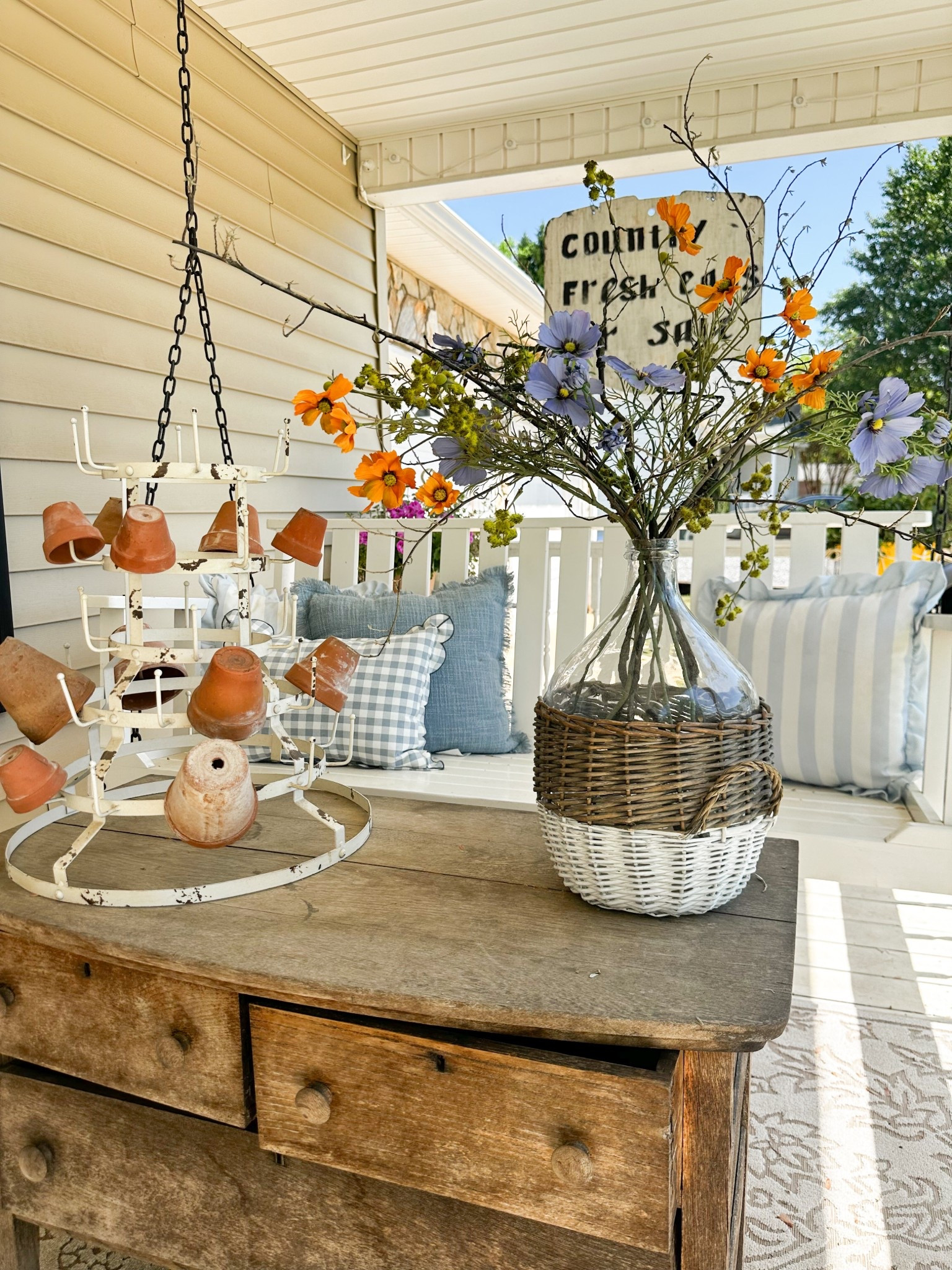 Cozy spring cottage porch with throw pillows and blooms 

#LTKSeasonal #LTKHome #LTKMothersDay