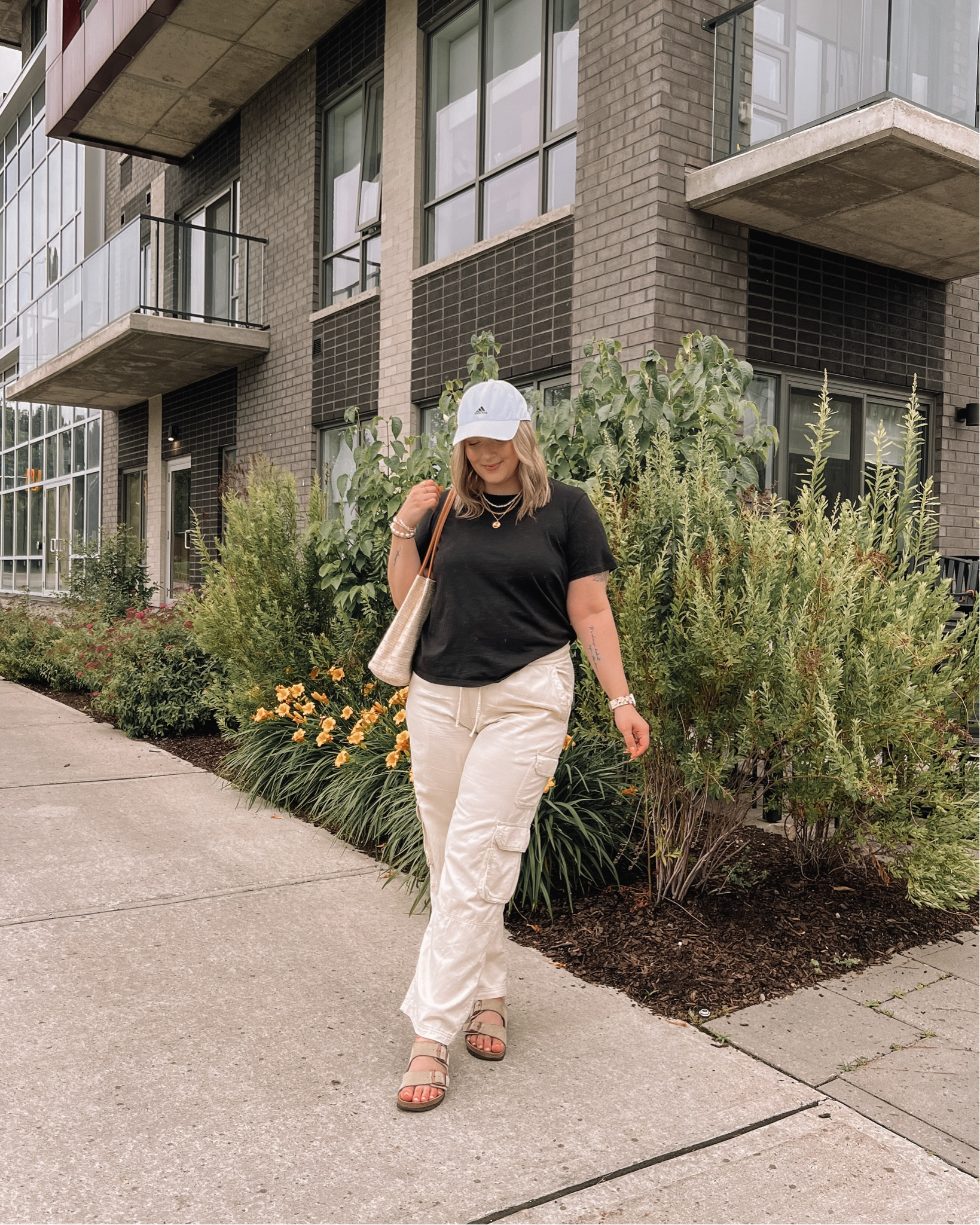 Simple midsize summer outfit - basic black tee (L), cargo pants (L), baseball cap, Birkenstock sandals, Amazon straw tote bag

#LTKmidsize #LTKsummer #LTKcanada