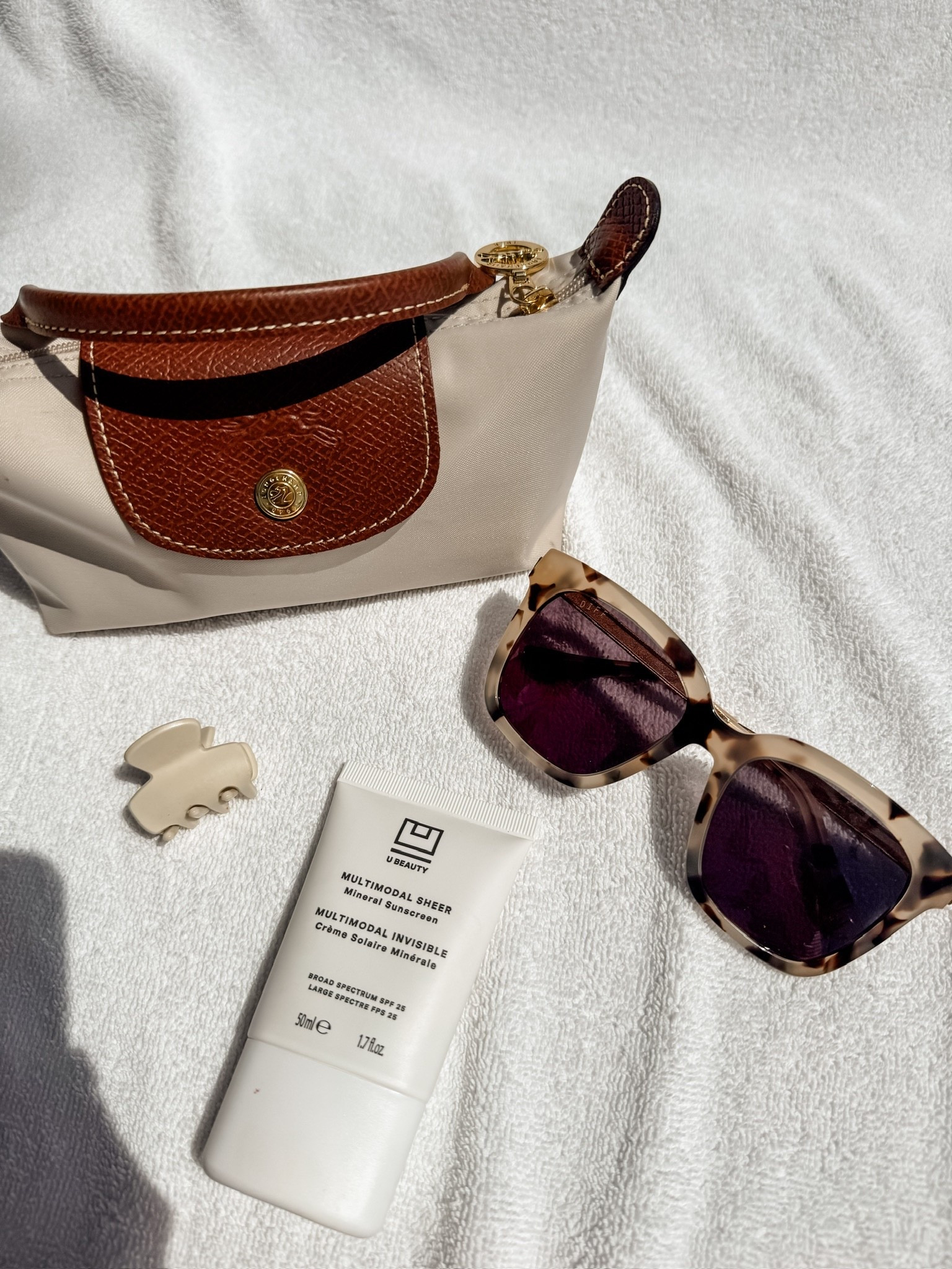 I love keeping accessories in my mini Longchamp pouch! Easy and chic way to keep your bag organized and for extra protection on small items!

Loverly grey, what’s in my summer bag, sunscreen daily mineral, tort sunglasses, summer must haves

#LTKTravel #LTKSeasonal