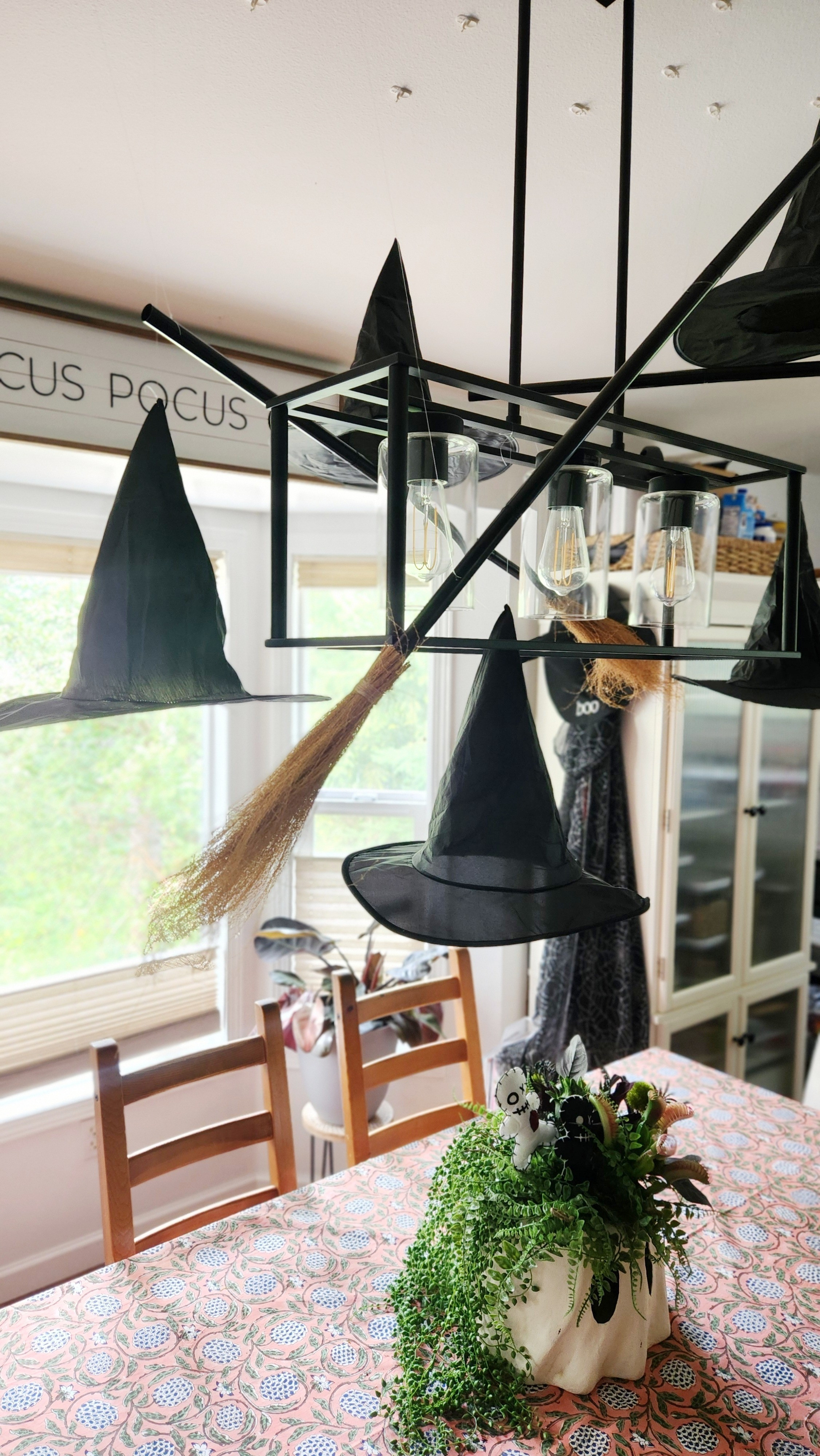 An easy way to set a spooky scene...hanging hats and brooms with fishing line.

#LTKSeasonal #LTKHome #LTKFindsUnder50