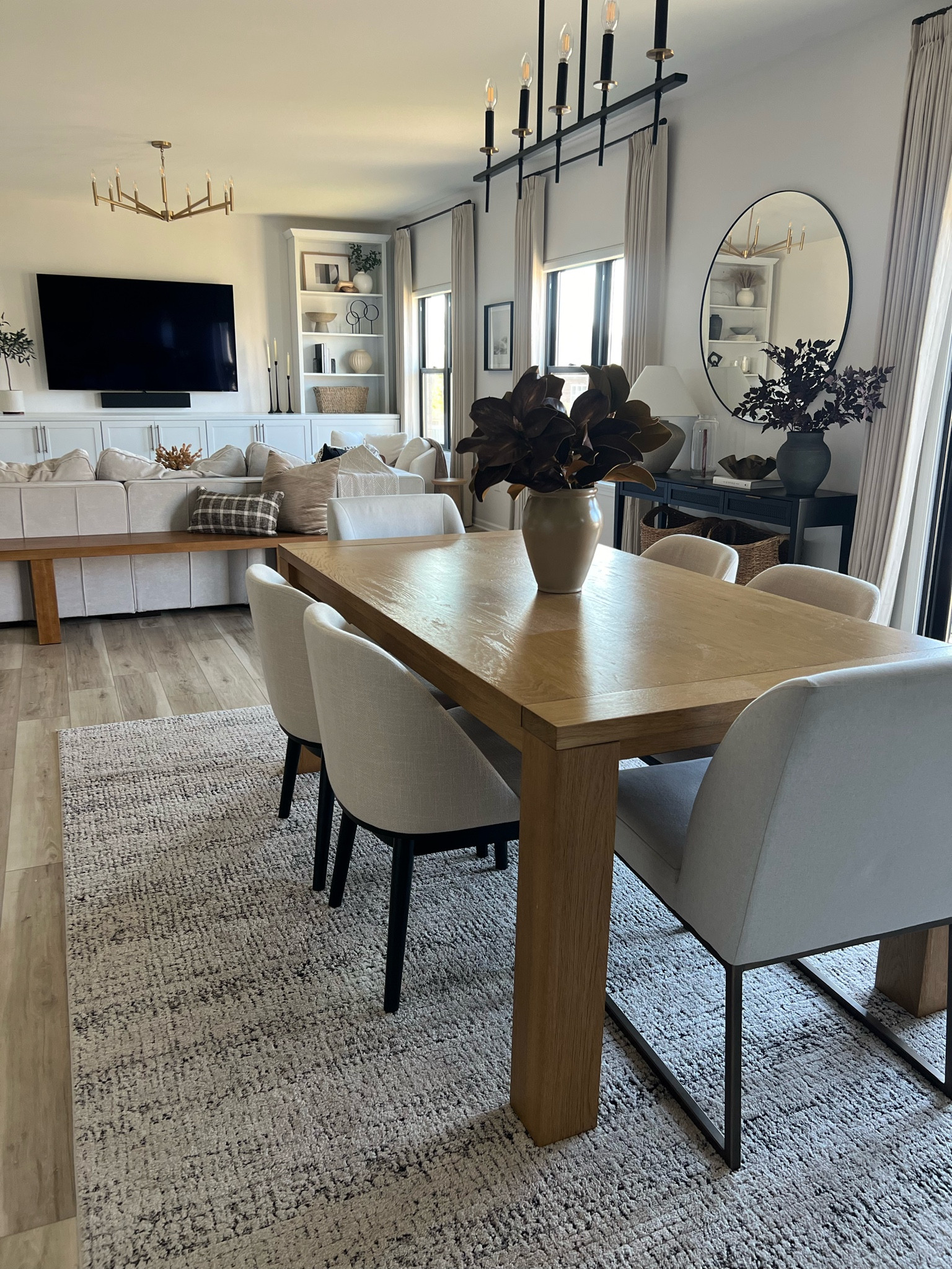 Open dining area/ family room. My table is an older version from West Elm. I linked a few similar options.

Curtains are linked - I have the double pinch pleat with memory training 

Dining table, dining chairs, area rug, console table 

#LTKHome