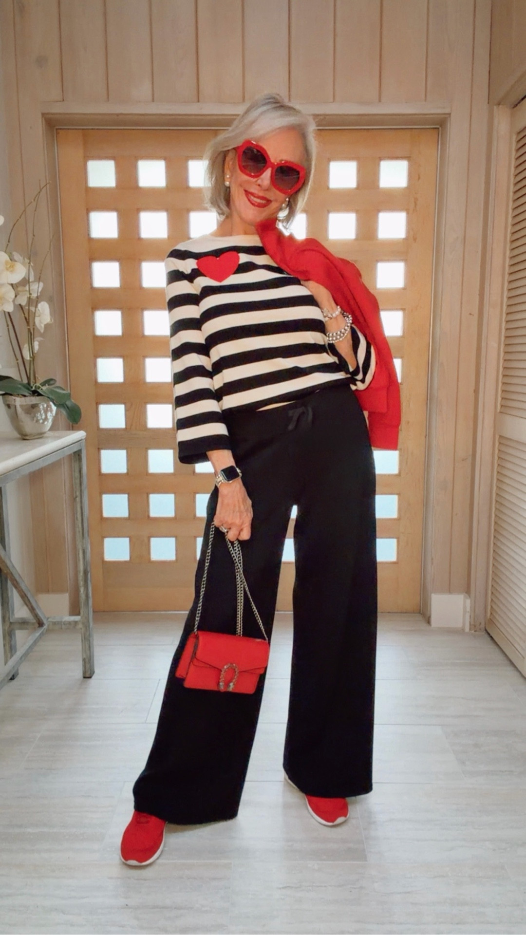 WHO doesn’t love stripes. Made with love — red heart, striped design tipped in red. A face-flattering boat neckline and colorblock details on the sleeves add the perfect finishing touch.
Valentine’s Day outfit
Spanx Ponte knit wide leg pull on pant, red sneakers, Gucci bag, red sunglasses double pearl earrings, pearl bracelet stack, GRWM,

#LTKSeasonal #LTKOver40 #LTKActive