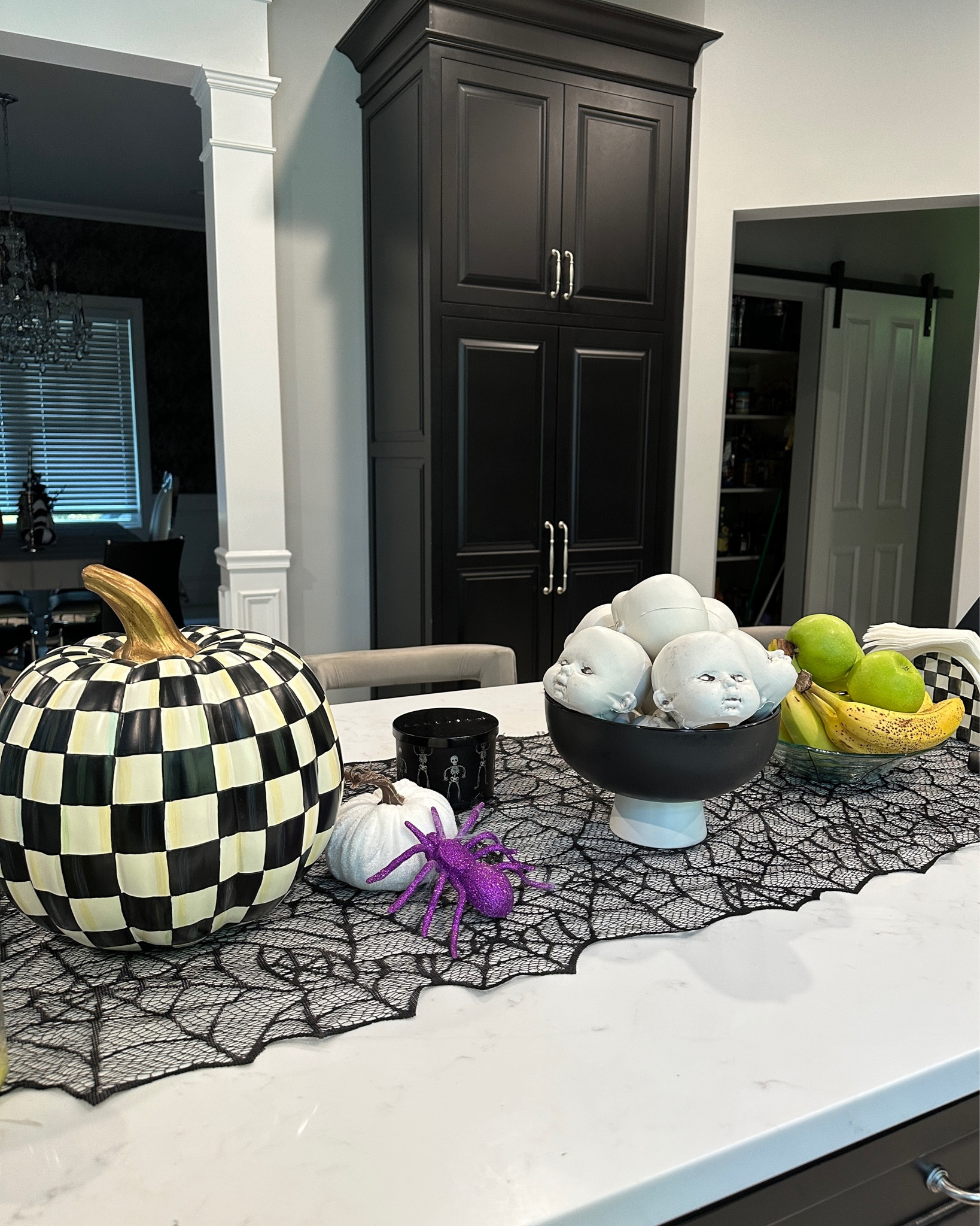 Some of this year’s Halloween decorations on my kitchen island. The spiderweb table runner and Mackenzie and Childs pumpkin are staples I use every year. The baby doll heads are a newer addition and I just got the fruit bowl this year. Will add more before our Halloween party at the end of the month and then change up in November for more general fall decor. 

#LTKSeasonal #LTKHalloween #LTKhome