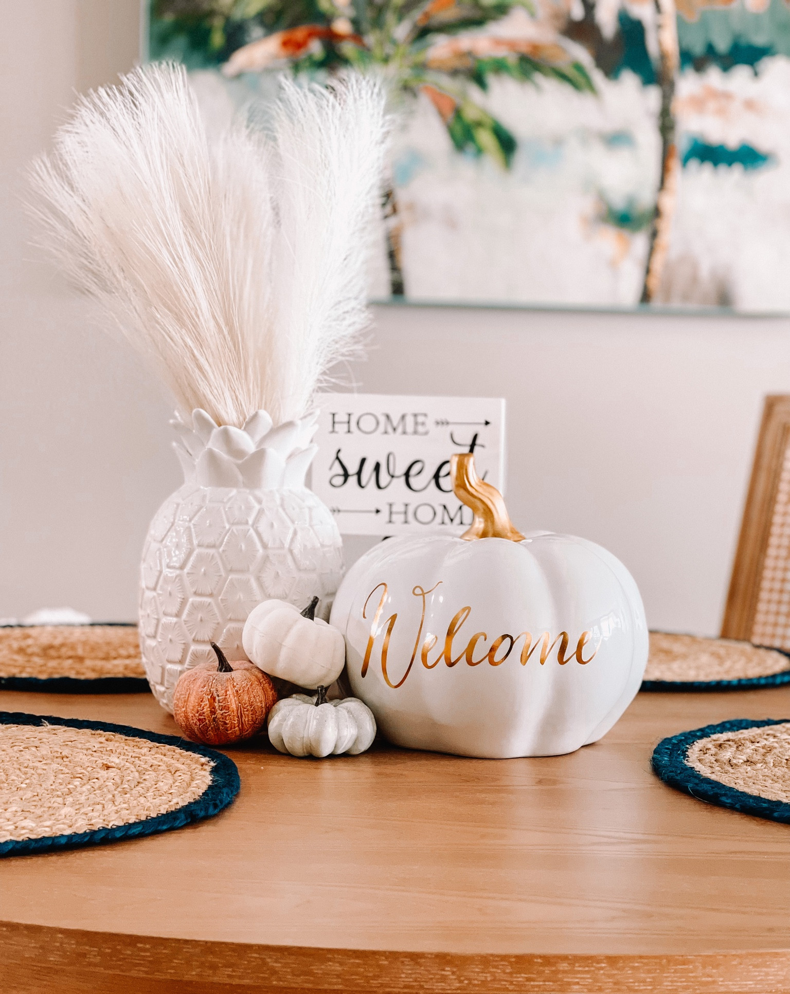 Finally finished up decorating for fall! Why does it feel like I am going to blink and it’s going to be time to drag out our Christmas decorations?! 

I left out our Mud Pie pineapple vase and added a ceramic white and gold welcome pumpkin. Along with a few small stonewash pumpkins. Replaced the tropical palm stems with pampas grass stems. 

I also just left out our jute and navy blue placemats this year instead of replacing them  

#LTKhome #LTKSeasonal #LTKHoliday