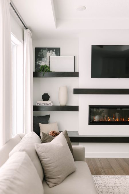 Living room floating shelf decor.

LIVING ROOM // LIVING ROOM INSPO // LIVING ROOM DESIGN // LIVING ROOM DECOR // LIVING ROOM FURNITURE // MODERN LIVING ROOM // ROOM DECOR // AFFORDABLE FURNITURE // FLOATING SHELF STYLING // FIREPLACE // MANTEL 

#LTKfindsunder100 #LTKstyletip #LTKhome