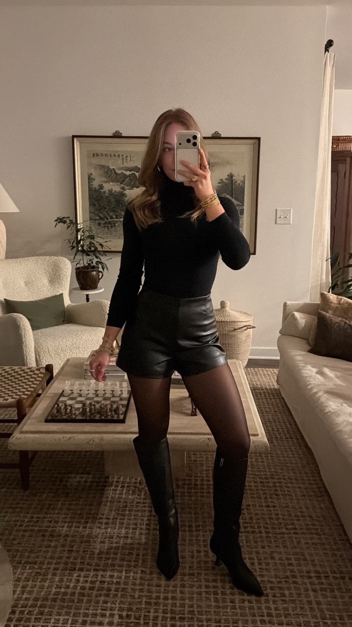 1/1/26 New Year’s Eve outfit details — but also a great winter going-out look. I’m wearing knee-high leather boots with a low heel (comfortable enough to stand around in), black Amazon stockings, leather shorts from Zara, and a black Commando bodysuit. The fur jacket I’m wearing is an older Abercrombie style, so I linked a similar option, and I finished the look with my Bottega bag. Classic, elevated, and easy to rewear all winter.

#LTKGiftGuide #LTKSeasonal