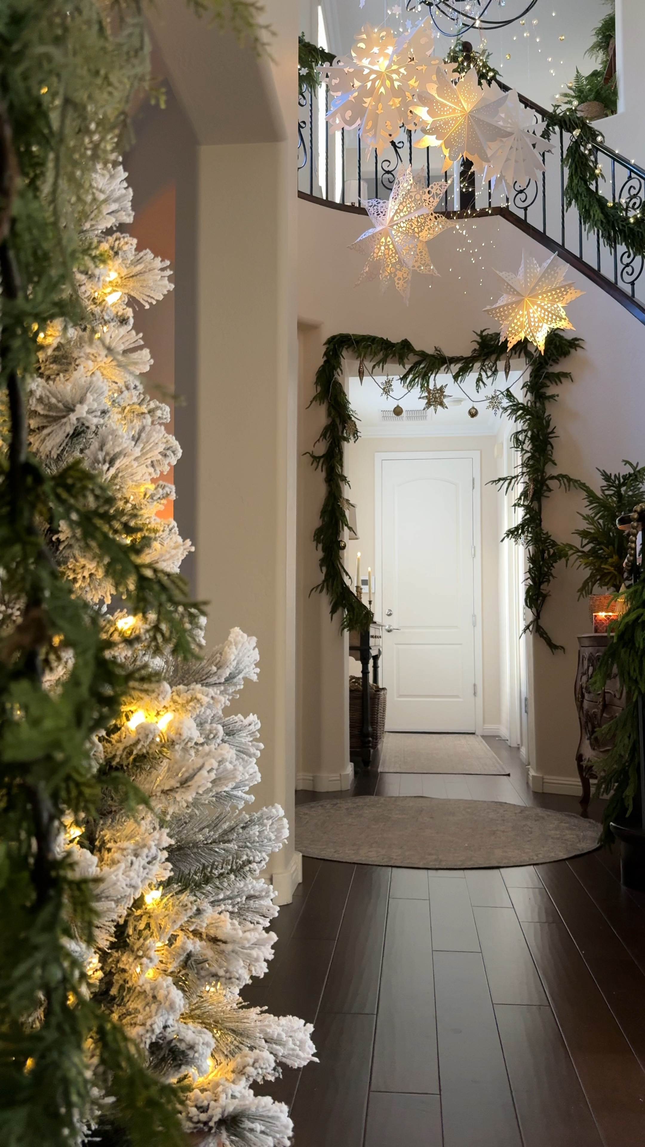 Cascading Snowflakes and twinkly lights for a magical entryway. 

*I put puck lights inside the snowflakes so I could control it with a remote. 

#christmasdecorations #holidaydecor#LTKVideo

#LTKHome #LTKHoliday