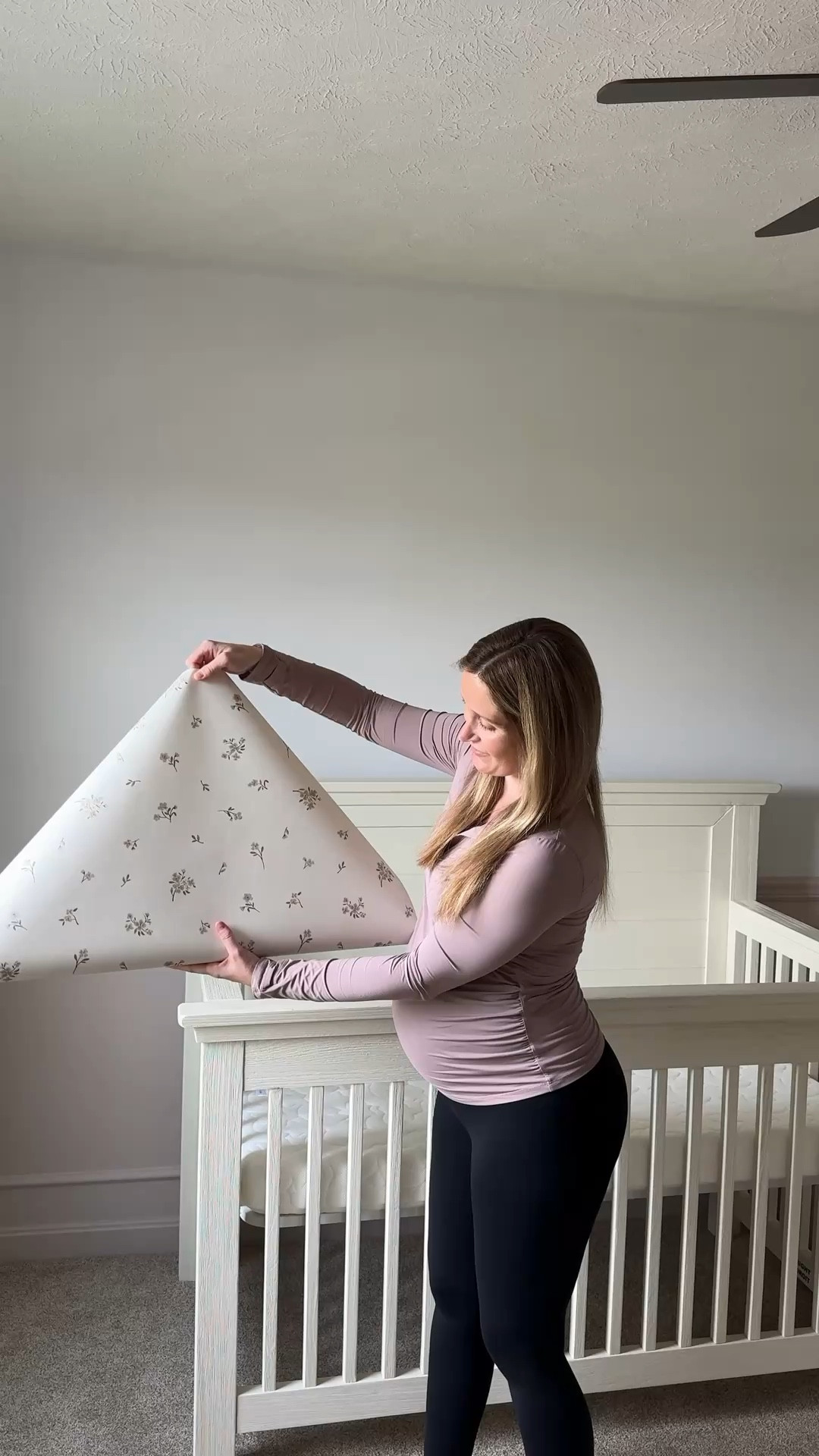 Slightly whimsical and dainty nursery coming together! I just finished the wallpaper, dresser and hung our curtains! 

