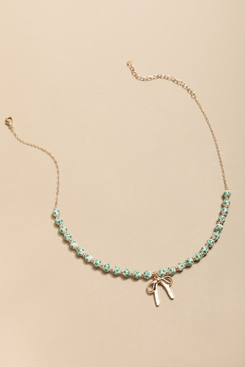 April Ceramic Bead Bow Pendant Necklace | Francesca's
