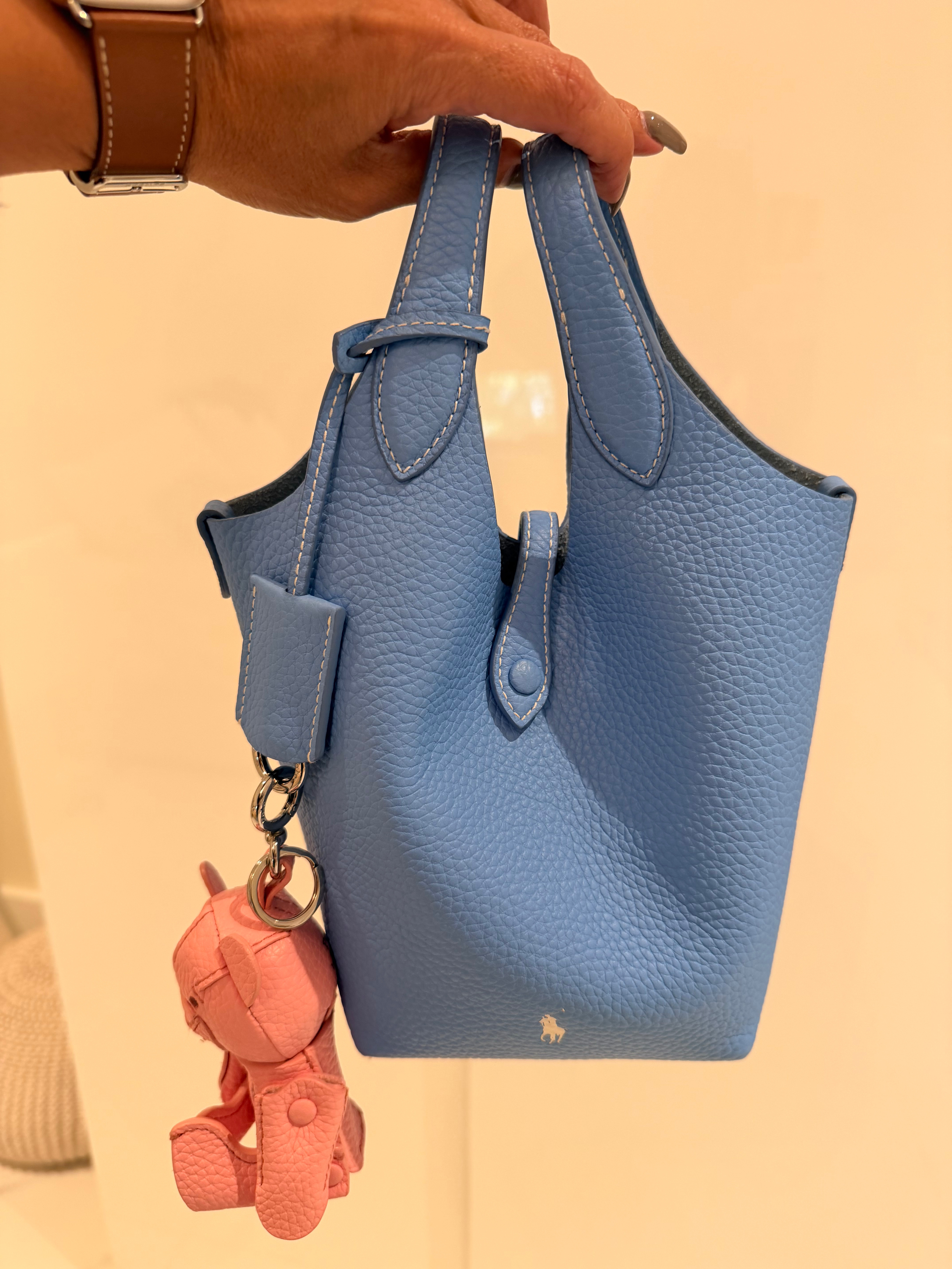 How cute are these bucket bags from Polo by Ralph Lauren. Adding a pop of color with these playful mini bags never look so chic. Available in Many Colors and also they come with removable strap for a crossbody option. 

 