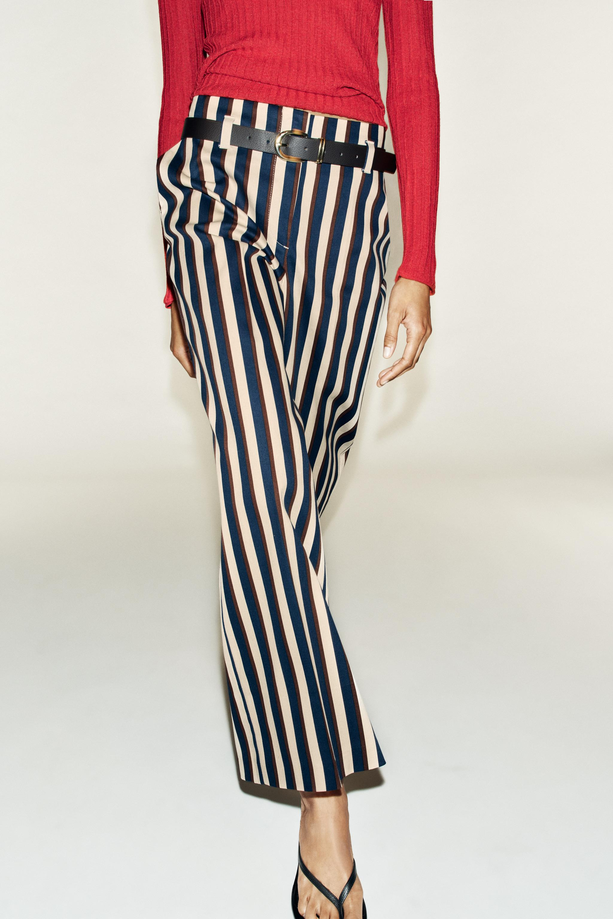 High-waist trousers with front pockets. Featuring a belt detail, straight leg, and front fastenin... | Zara IT