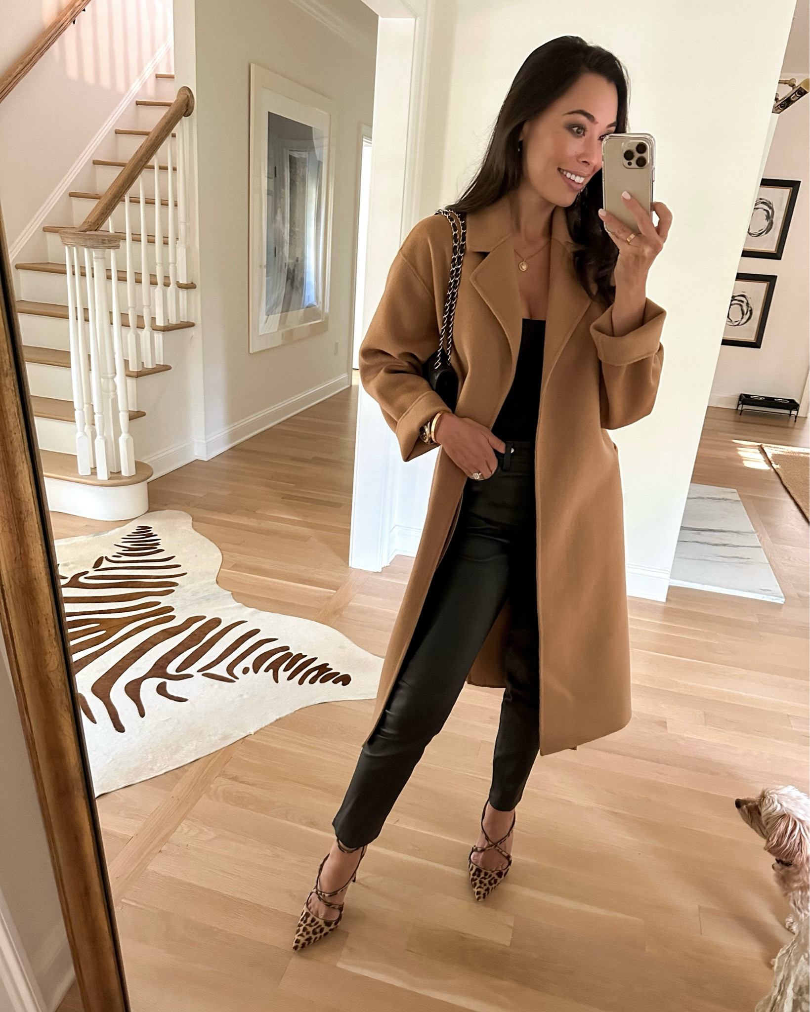 Kat Jamieson wears a camel coat, leather pants and black bodysuit with leopard heels. Fall date night, classic style. 

#LTKshoecrush #LTKparties #LTKSeasonal