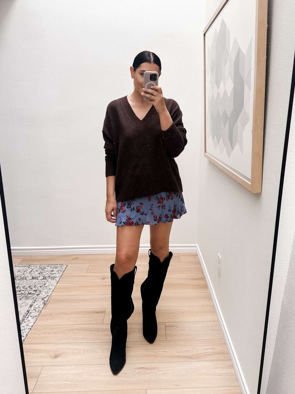 I'm in the large of the brown sweater, it runs generous, no need to size up. 
I'm in the large of the skirt, but it runs TTS. 

I'm in the medium of the grey sweater, oversized. TTS.  

 