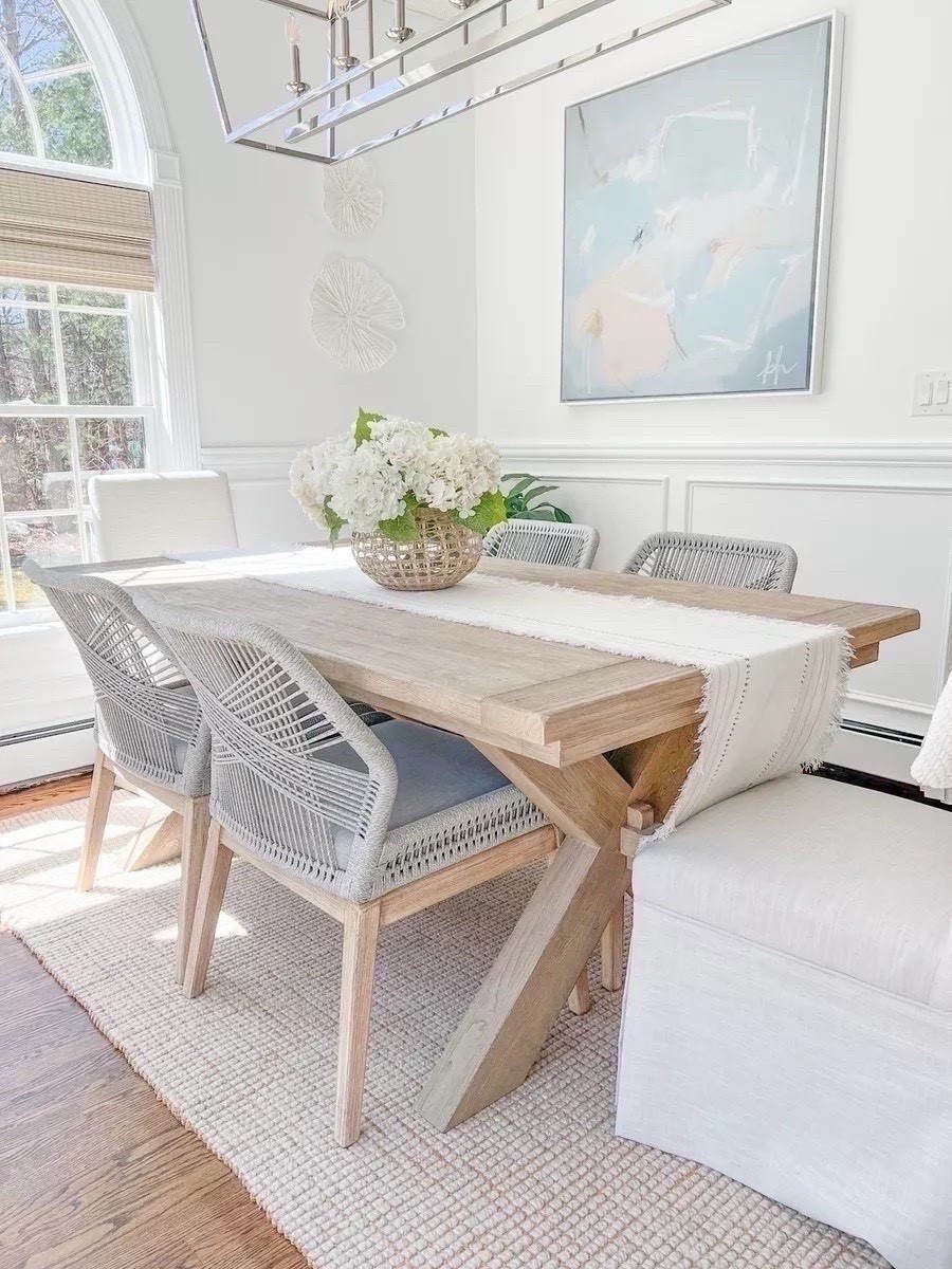 I bought our dining table close to nine years ago and it's still one of my favorite home purchases! This is the seadrift finish in the 74"-104" size, and my rug is the natural color.  
----
coastal dining room, dining room decor, neutral dining room, neutral home decor, neutral decor, beach decor, beach style, dining room furniture, dining room ideas. faux flowers, amazon hydrangeas, woven vase, large vase, serena & lily vase, coral wall decor, dining room table chairs, pottery barn dining table, Toscana dining room table, dining room chairs, dining room rugs, pottery barn rugs, coastal rugs, coastal artwork, abstract artwork, large artwork, blue artwork, woven shades, 8x10 rugs, 5x8 rugs, 9x12 rugs, dining room tables on sale, dining room ideas, dining room decor, white dining room, jute rugs, wool rugs, neutral rugs, dining tables with leafs

#LTKHome