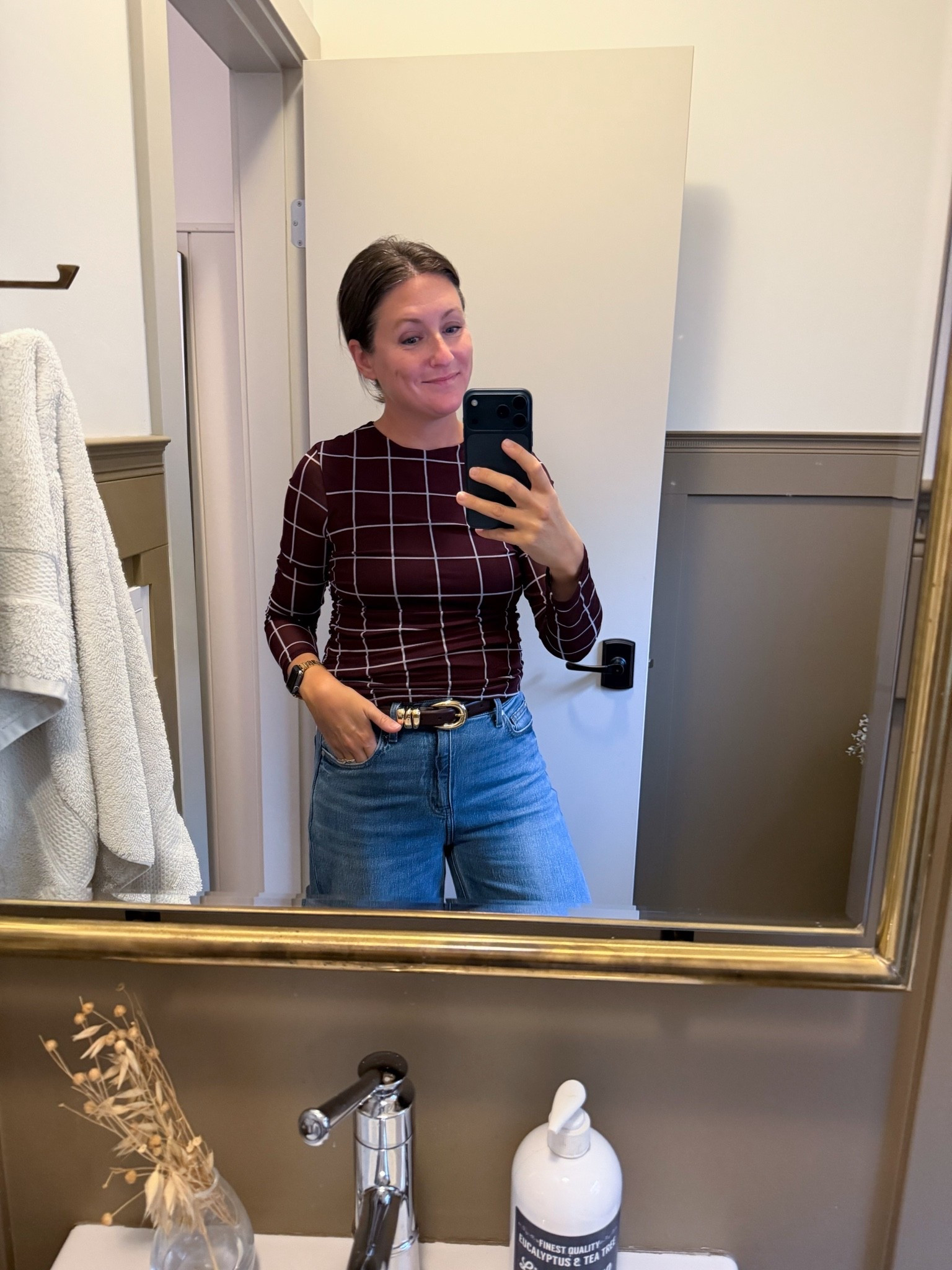 I'm obsessed with this Target top! The mesh sleeves and ruched sides make it feel so fall, and it's only $18. The body is lined, so only the arms are sheer. It comes in a dark brown plaid (which I’d say is more burgundy), burgundy dots, and olive green. I'm wearing a size small. Linked here!