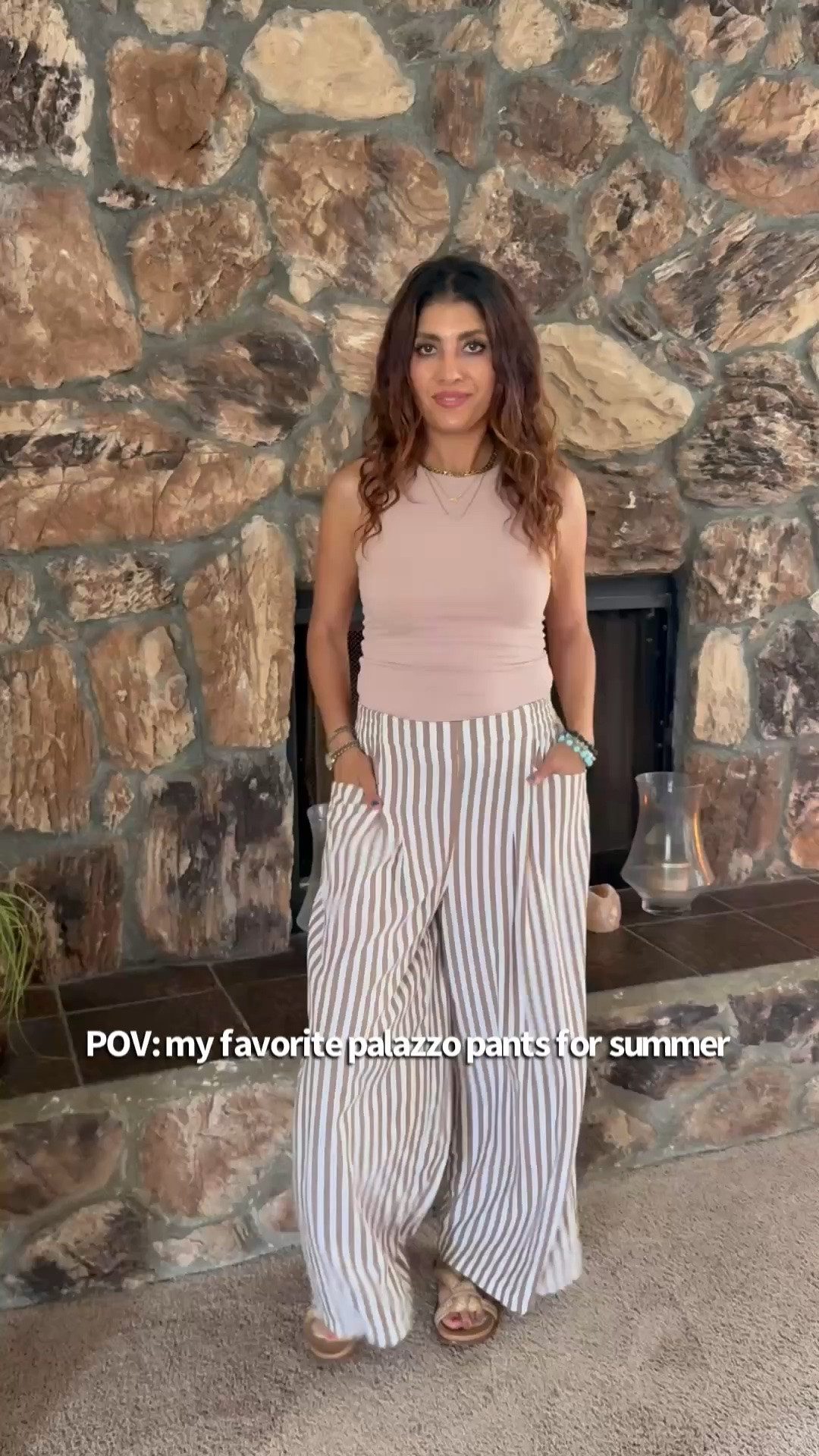 Neutral outfit perfection 🤍 These striped palazzo pants are lightweight, flattering, and so easy to style for spring & summer. Paired them with a fitted ribbed tank, mini shoulder bag, and oversized sunnies for an effortless chic everyday look. Perfect for brunch, vacation, errands, or a casual date night outfit. #LTKStyle #OOTD

striped palazzo pants, wide leg pants outfit, neutral outfit, beige tank top outfit, spring fashion, summer outfit inspiration, chic casual outfit, effortless style, vacation outfit, resort wear, everyday fashion, womens style over 40, classy casual outfit, comfy chic look, ribbed tank top, striped trousers, minimalist fashion, neutral aesthetic, brunch outfit, coastal chic style

#LTKdayinmylife #LTKSeasonal #LTKOver40
