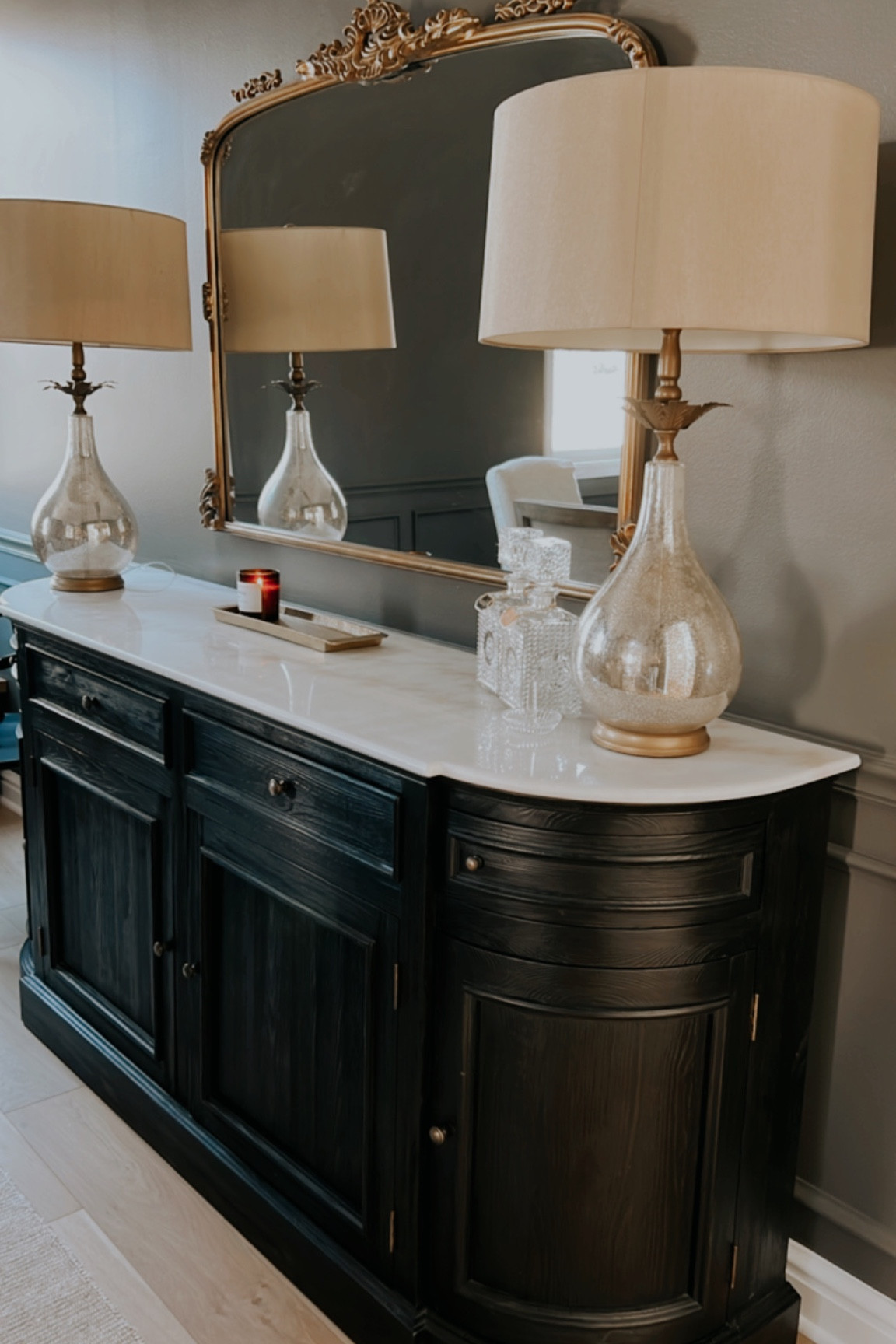 Dining room buffet table black furniture modern contemporary dining room styling gold lamps gold mirror statement mirror

#LTKstyletip #LTKhome #LTKunder50