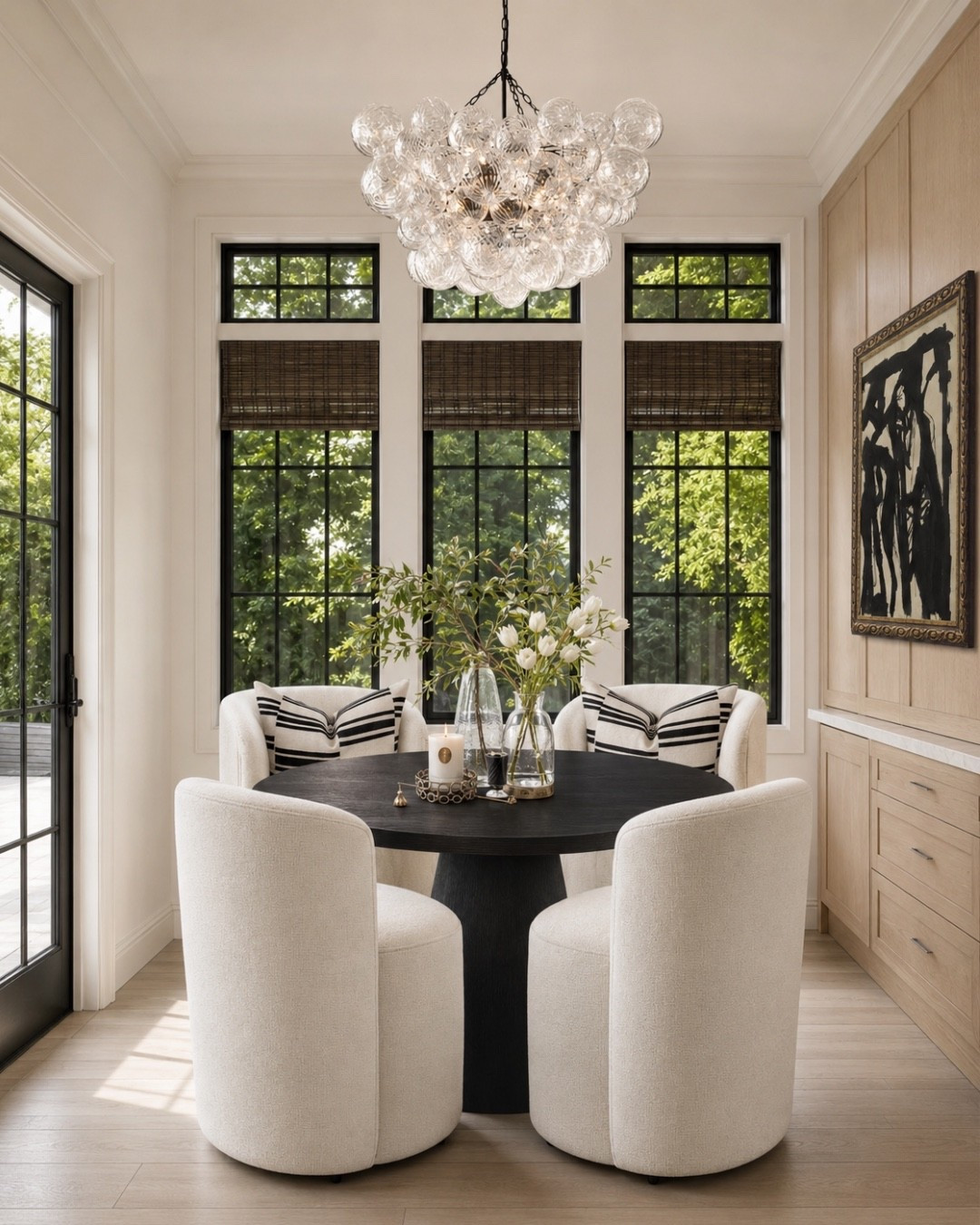 A polished breakfast nook that proves a small dining space can still feel elevated. The mix of boucle dining chairs, a black pedestal table, woven shades, black window frames, and sculptural lighting gives this room that high-end modern classic look without feeling too formal. Perfect inspo if you’re styling a breakfast nook, small dining room, or kitchen dining corner.
I may receive a commission when you shop through my links.

#LTKHome