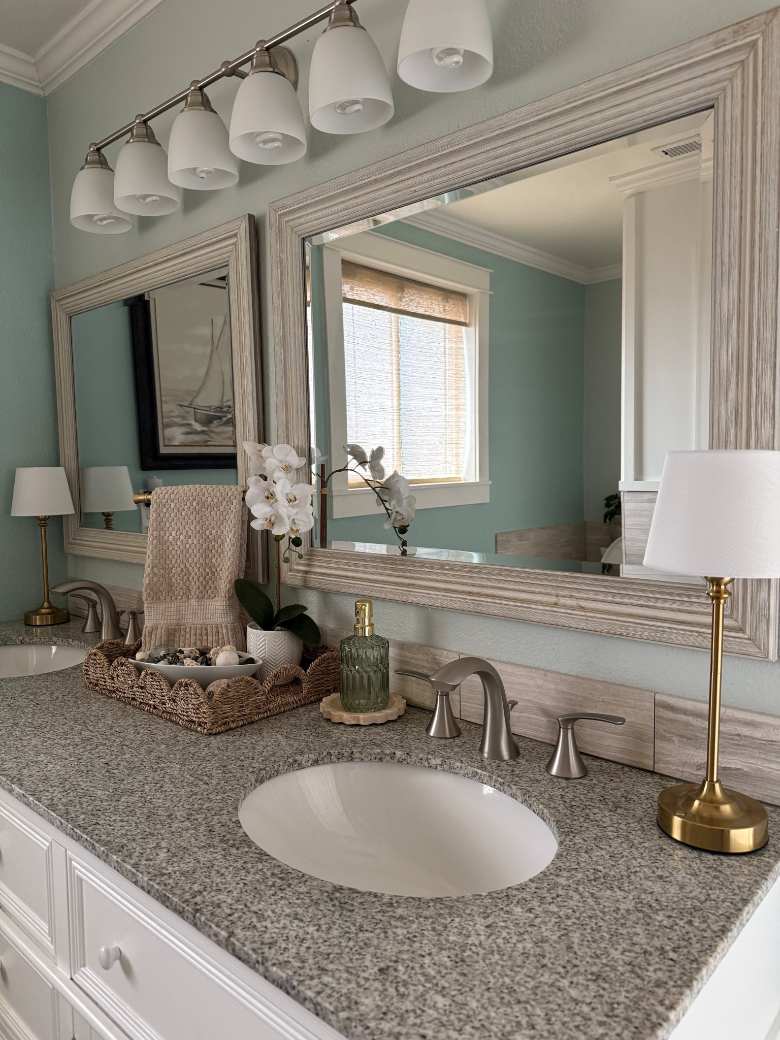 Coastal cottagecore bathroom refresh 🌊
Soft blues, warm neutrals, natural textures, and vintage-inspired details come together in this coastal chic bathroom refresh. A light, airy take on cottagecore with relaxed seaside charm—perfect for anyone who loves coastal home decor, timeless bathroom styling, and calm, collected spaces that feel both fresh and lived-in. 

#LTKSeasonal #LTKHome #LTKdayinmylife
