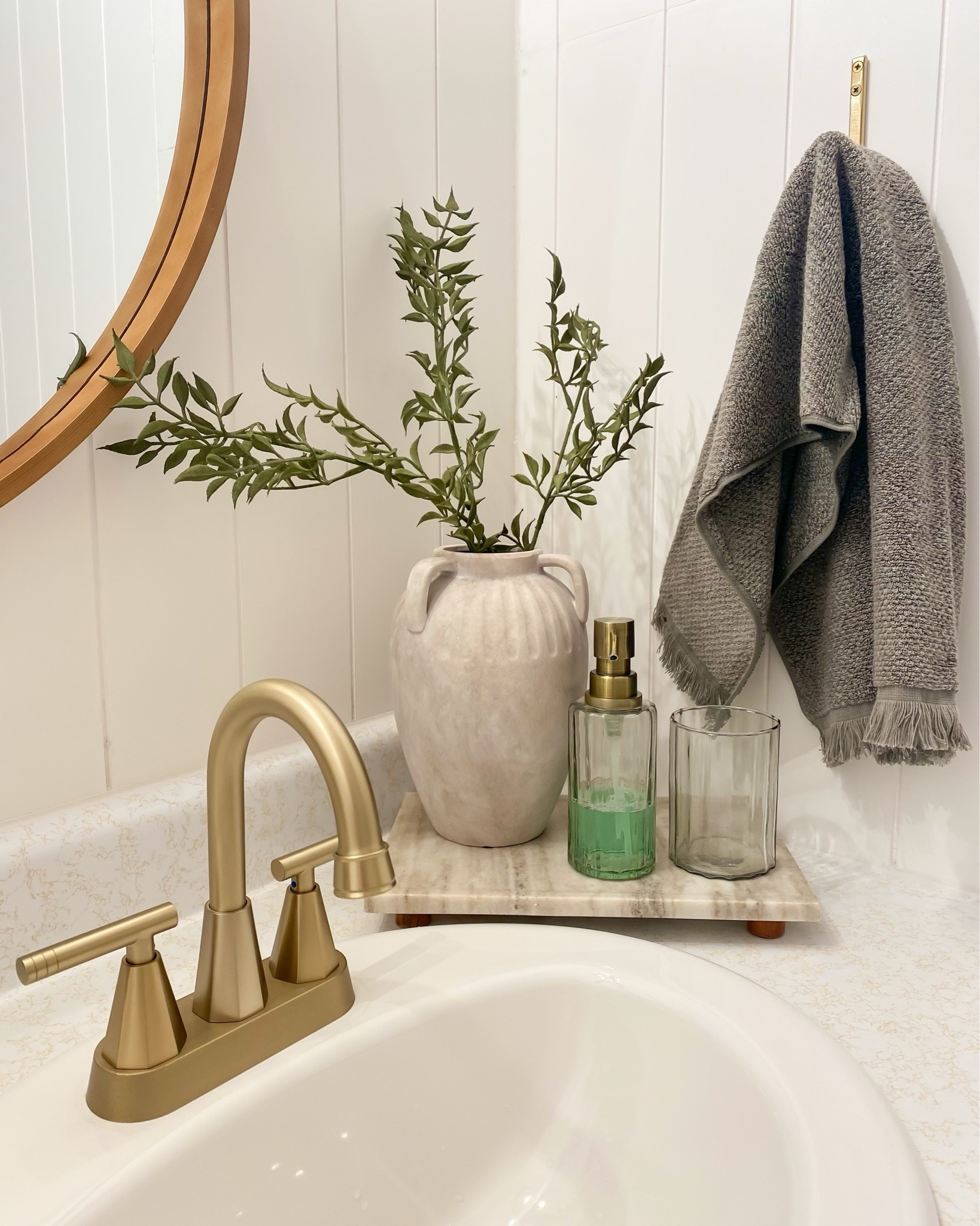 Bathroom Countertop Styling Ideas 🤎 
bathroom countertop styling idea, bathroom organizer idea, glass canister, terracotta vase, peony, marble tray, marble footer, landscape art @Target @Michaels 

#LTKSaleAlert #LTKHome #LTKSeasonal