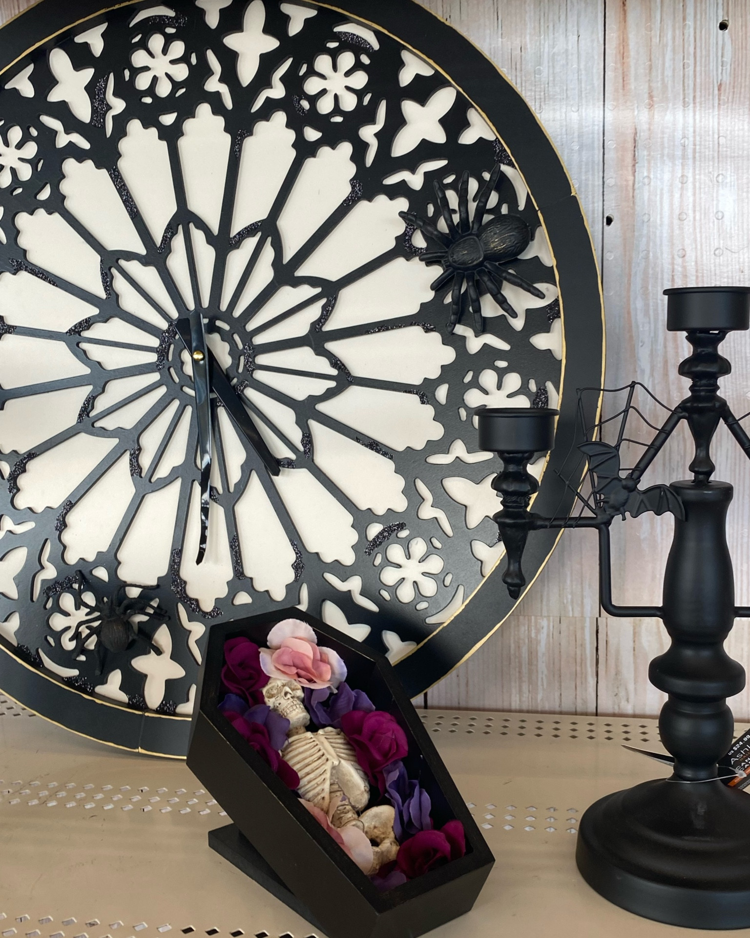 Hit the right mix of spooky and enchanting in your Halloween décor with this gorgeous wall clock from Ashland. This piece featuring an intricate web design with two spiders lurking on the edges will make a wonderful addition to your walls paired with a gothic floral arrangement and haunting artwork.

Hit the right mix of spooky and enchanting in your Halloween décor with this lovely candelabra tabletop accent from Ashland. Add a few taper candles, light them, and watch the candlelight dance between the metal towers. Place on a mantel or table display paired with a gothic floral arrangement and haunting wall art to set a creepy mood for your holiday party.

Decorate your home this Halloween with this spooky skeleton coffin decoration by Ashland. Place it on your coffee table or side table with matching décor for a festive display.

#LTKwedding #LTKHalloween #LTKSeasonal