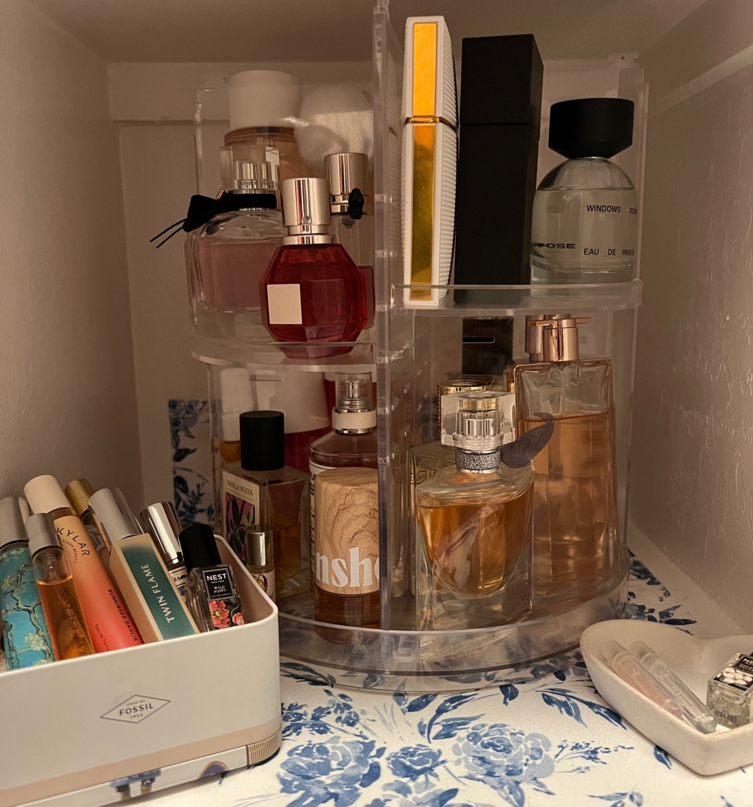 Perfume organization on acrylic organizer that has adjustable shelves and a rotating base. 

#LTKhome #LTKfindsunder50