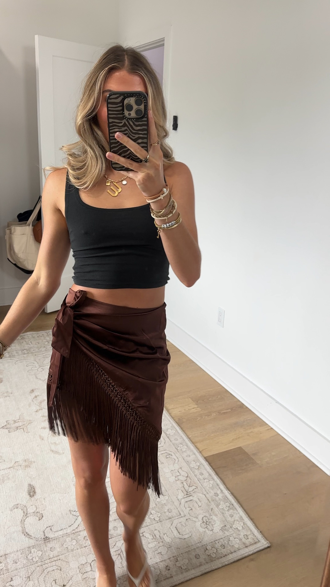 @12th Tribe size xs code is SLOANEFES10. Hey, did you know you're the occasion? Slay in the Canela Espresso Satin Fringe Sarong this Summer. The espresso satin with an asymmetrical fringe hemline makes it way too easy to spend all day at the beach, dinner with a view, and drinks around town. Throw it in your suitcase this hot girl summer for every vacation on the calendar.

#LTKootd #LTKSaleAlert #LTKSeasonal