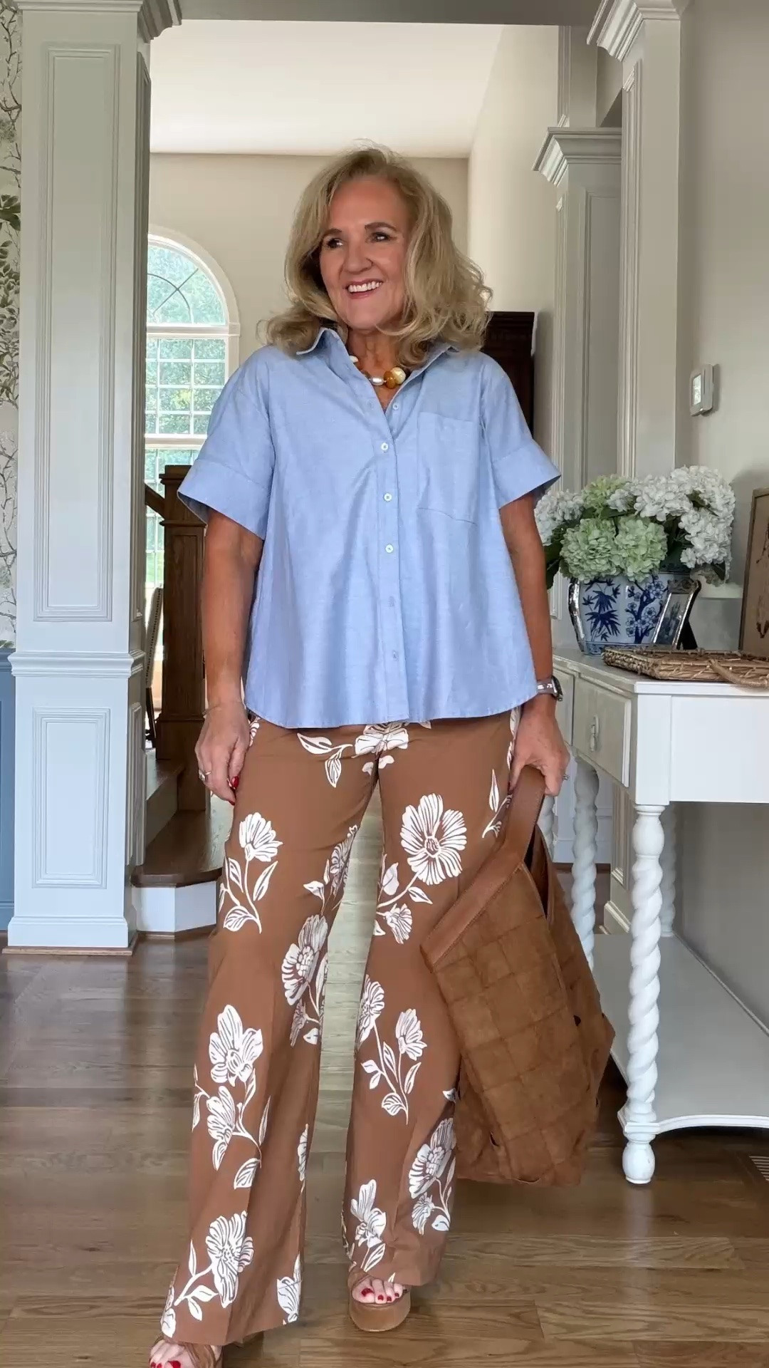 This light blue button-up and floral wide-leg pants are such an easy warm-weather combination. The relaxed fit feels comfortable while the bold floral print keeps the look polished.

💡 LTK MADE EASY
❤️ Heart = Support my posts!
🔖 Save = Get sale & restock alerts
📋 Lists = Keep favorites organized
📲 Share = Send lists and products to a friend. Hello, Christmas List!
💬 Comment = Ask me anything about what I'm wearing.:-)

#LTKootd #LTKdayinmylife #LTKOver40
