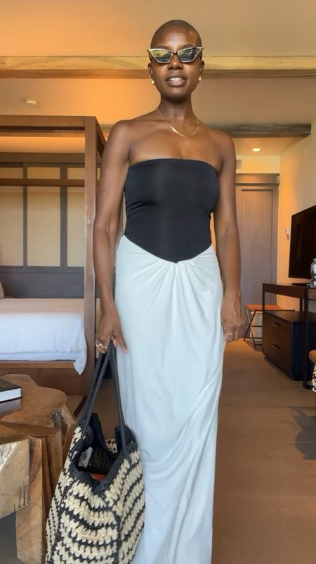 Vacation & Travel outfit! Strapless black and white slinky dress, black strappy sandals with gold toe and a two toned straw packable tote  

#LTKVideo #LTKFindsUnder100 #LTKTravel