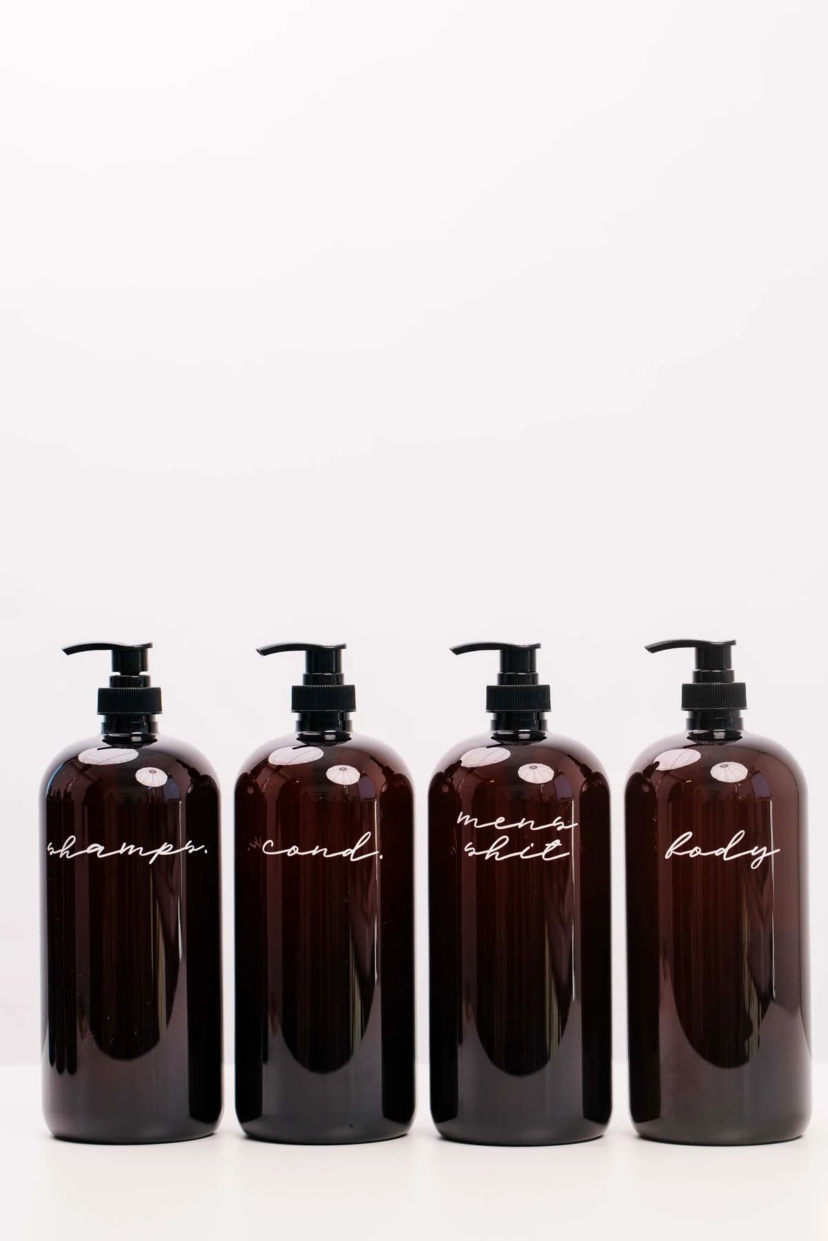LCo Exclusive: Plastic Shower/Bath Amber Liquid Pumps | THELIFESTYLEDCO